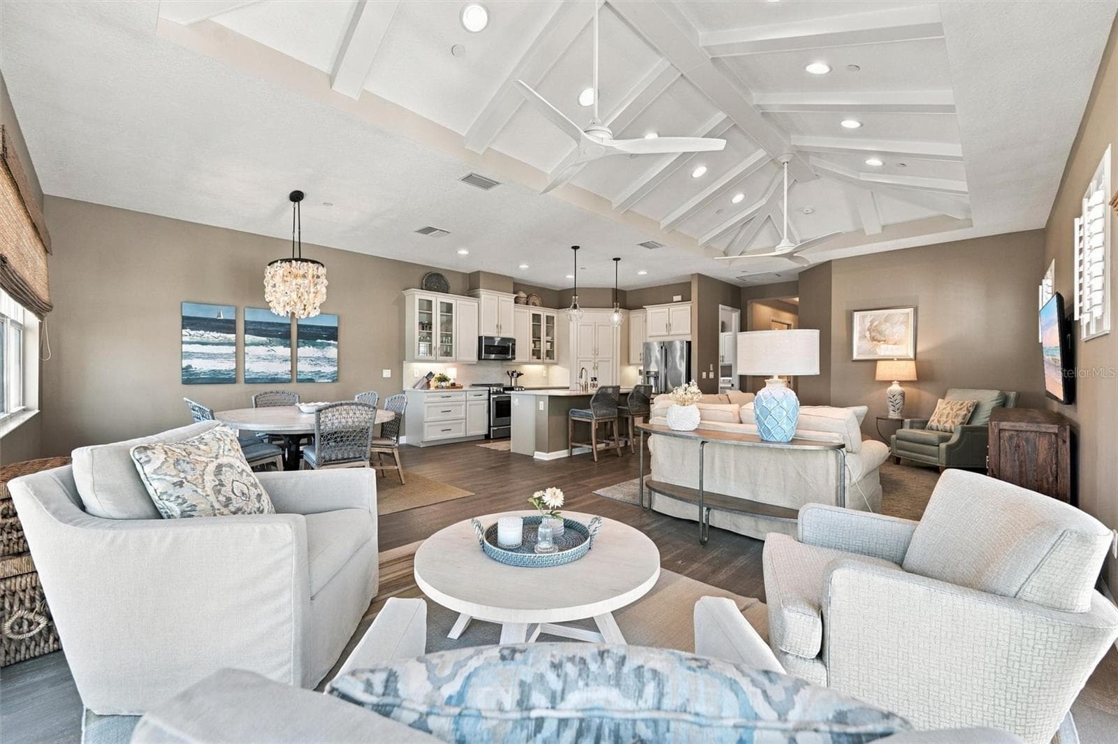 Enjoy peaceful Sapphire Lake views from this beautifully appointed home, featuring an open-concept floor plan, soaring vaulted ceilings, and Mohawk engineered hardwood flooring. - 291 COMPASS POINT DR #201, BRADENTON