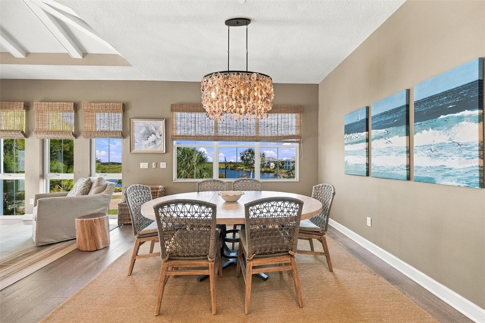 Enjoy peaceful Sapphire Lake views from this beautifully appointed home, featuring an open-concept floor plan, soaring vaulted ceilings, and Mohawk engineered hardwood flooring. - 291 COMPASS POINT DR #201, BRADENTON
