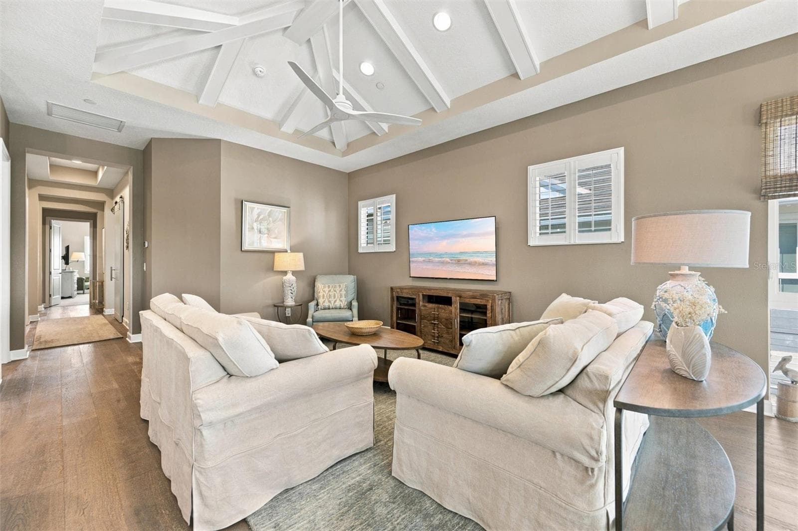 Enjoy peaceful Sapphire Lake views from this beautifully appointed home, featuring an open-concept floor plan, soaring vaulted ceilings, and Mohawk engineered hardwood flooring. - 291 COMPASS POINT DR #201, BRADENTON