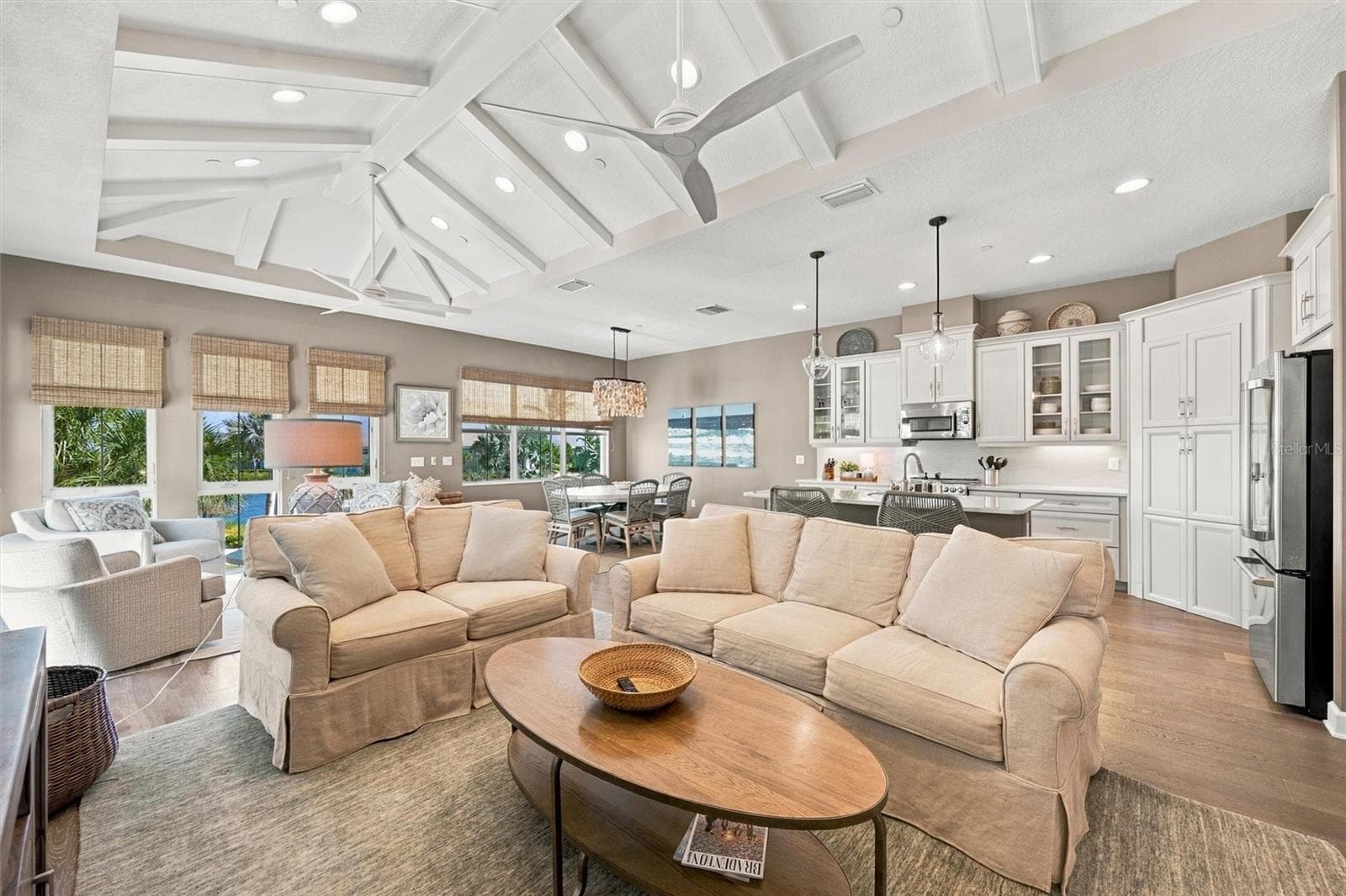 Enjoy peaceful Sapphire Lake views from this beautifully appointed home, featuring an open-concept floor plan, soaring vaulted ceilings, and Mohawk engineered hardwood flooring. - 291 COMPASS POINT DR #201, BRADENTON