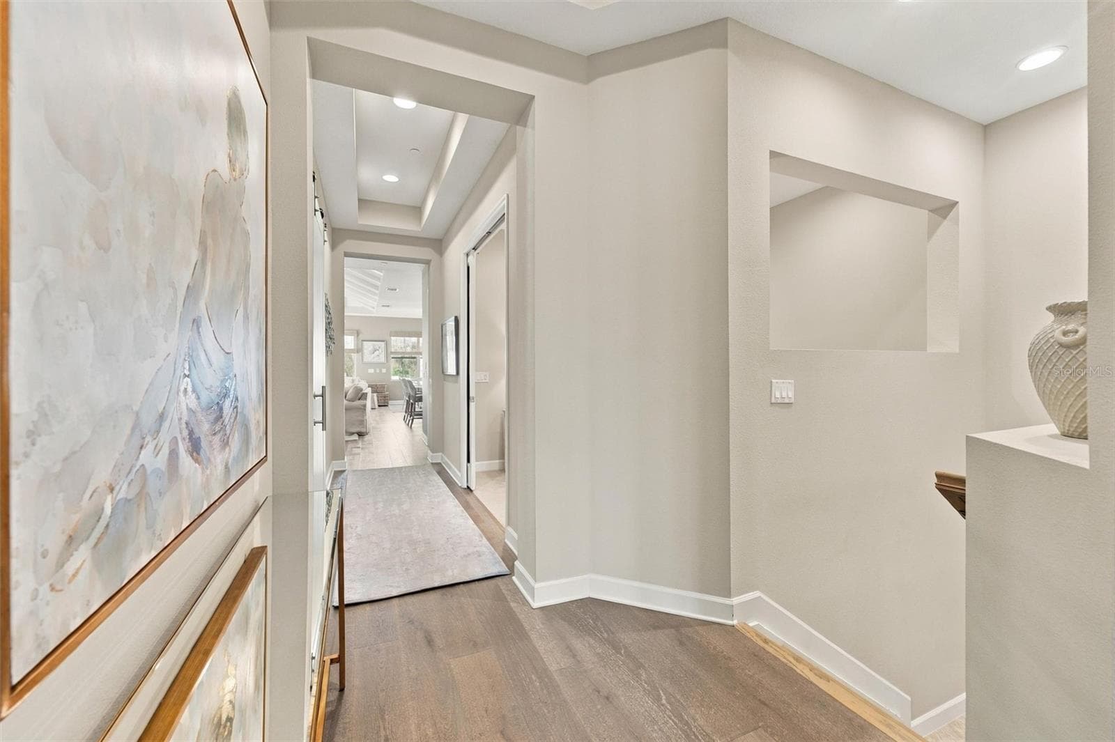 Hallway up the stairs that lead to the Bonus Room, Kitchen and Living Room area. - 291 COMPASS POINT DR #201, BRADENTON