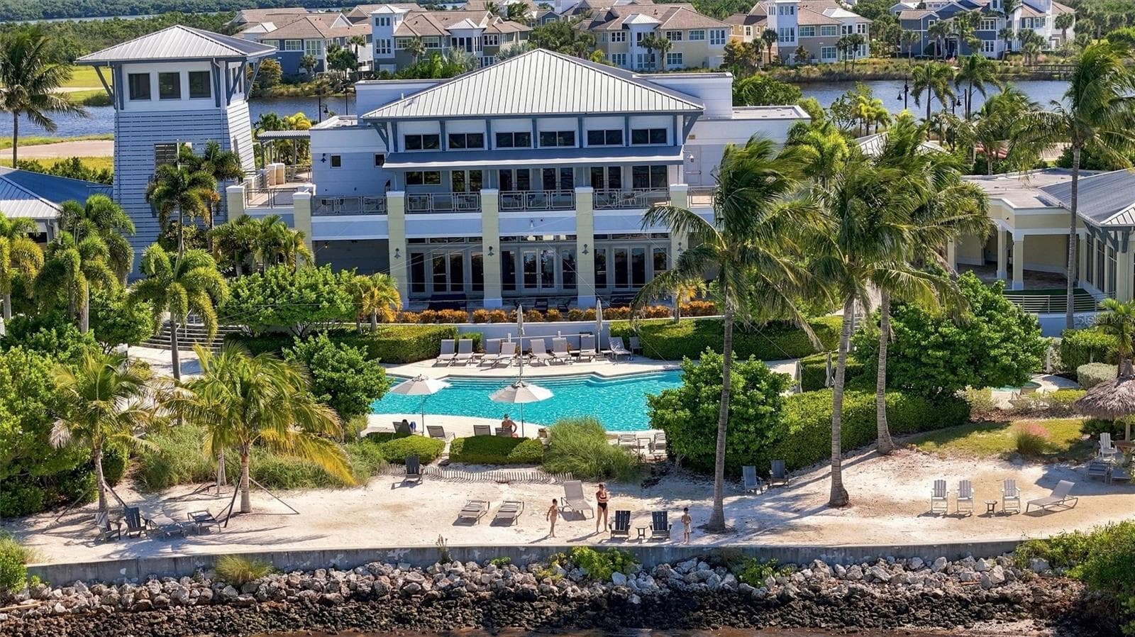 Enjoy an exceptional resort-style lifestyle with a 23,000-square-foot Beach Club, SkyBar lounge, heated resort pool and spa, private beach with kayak access to the Sound, and an impressive 4,200-square-foot fitness center. - 291 COMPASS POINT DR #201, BRADENTON