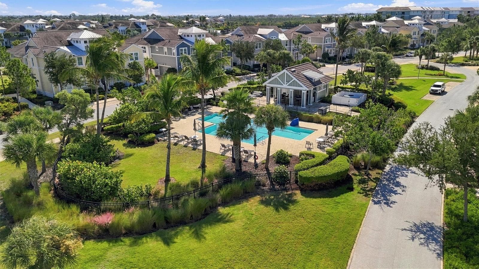 Lap Pool #2 Enjoy four community pools with cabanas and grills, plus a fun splash pad and playground—perfect for relaxing, entertaining, and making the most of Florida living! - 291 COMPASS POINT DR #201, BRADENTON