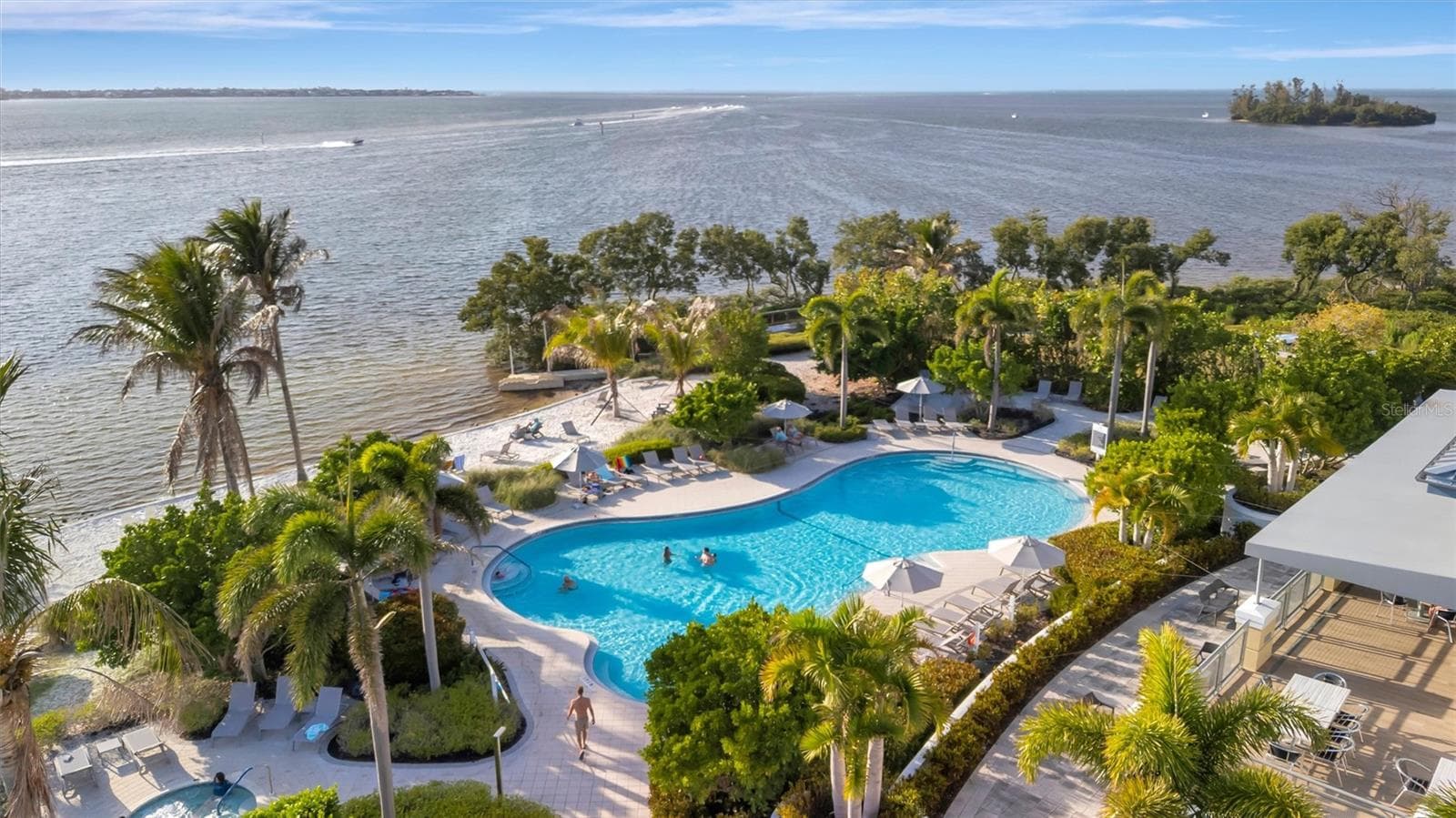 Enjoy an exceptional resort-style lifestyle with a 23,000-square-foot Beach Club, SkyBar lounge, heated resort pool and spa, private beach with kayak access to the Sound, and an impressive 4,200-square-foot fitness center. - 291 COMPASS POINT DR #201, BRADENTON