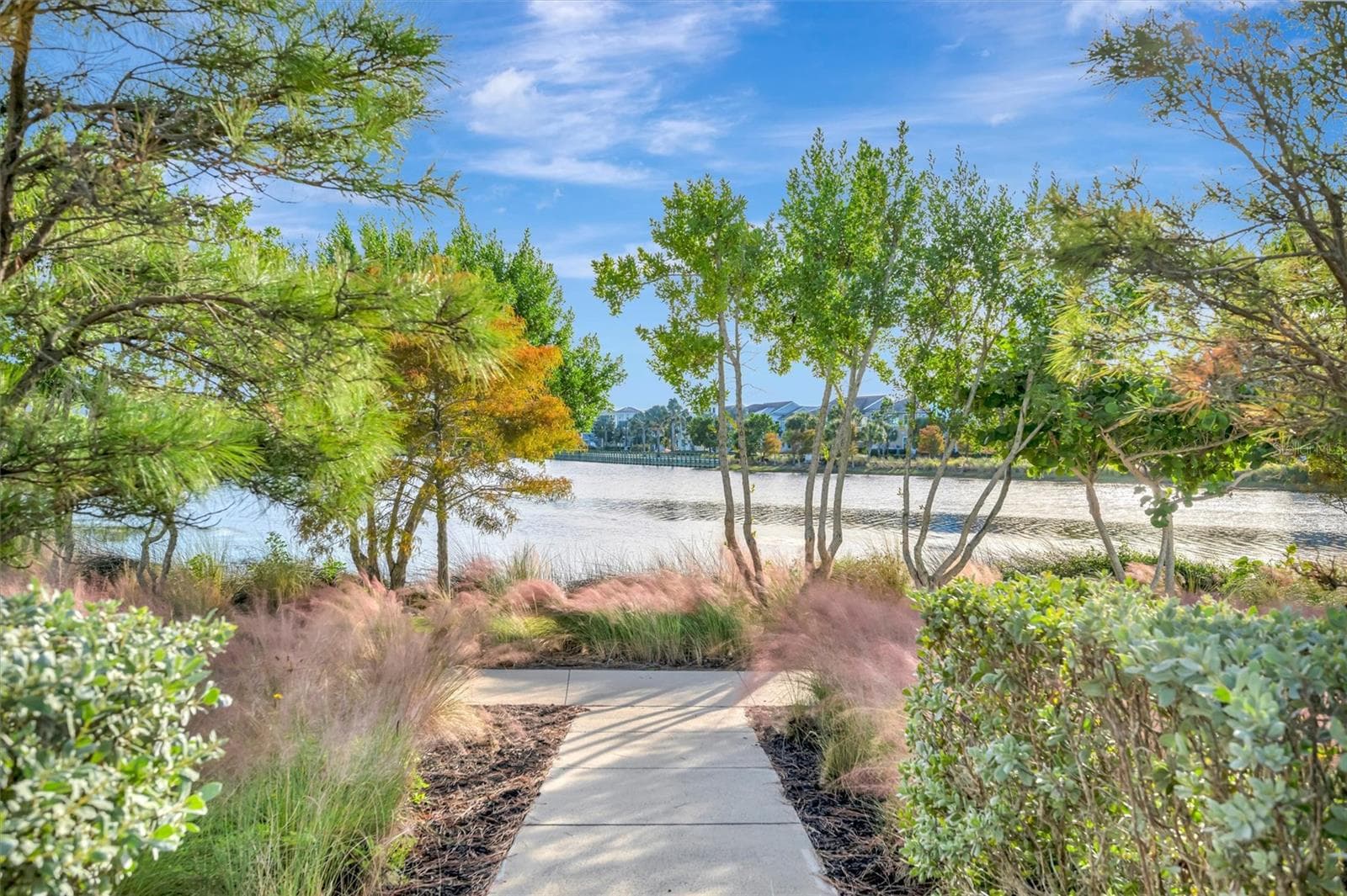 Enjoy two miles of scenic walking trails, perfect for getting outdoors and taking in the natural beauty of the community. - 291 COMPASS POINT DR #201, BRADENTON