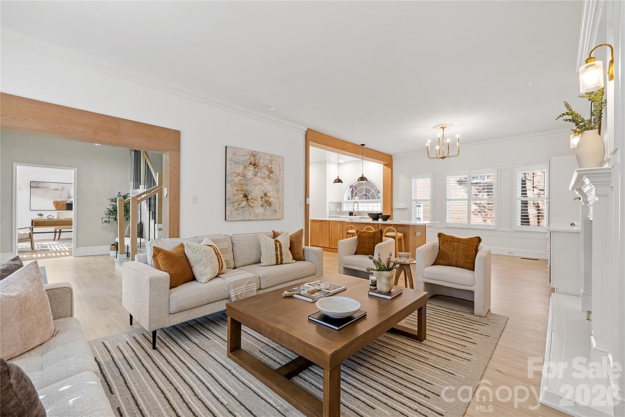 A warm and inviting living room filled with natural light offers a welcoming space to relax + entertain. - 4341 Old Saybrook Court, Charlotte