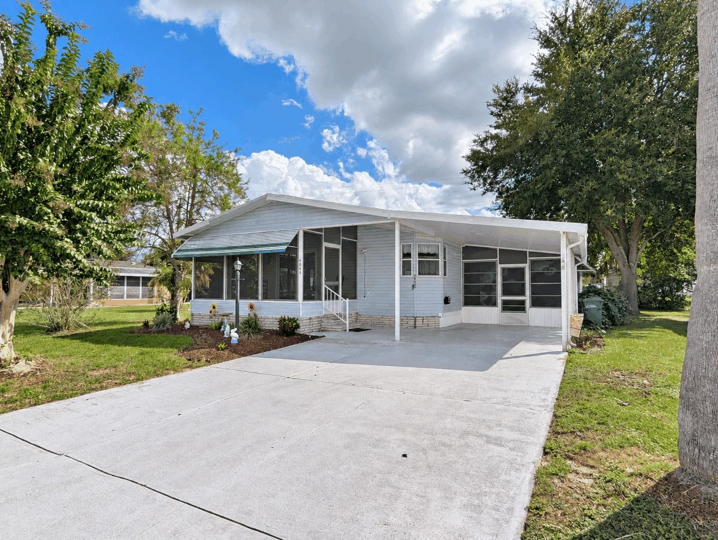 Manufactured Home at 6066 SE SOUTHERN OAKS DR, WINTER HAVEN, photo 2 of 36