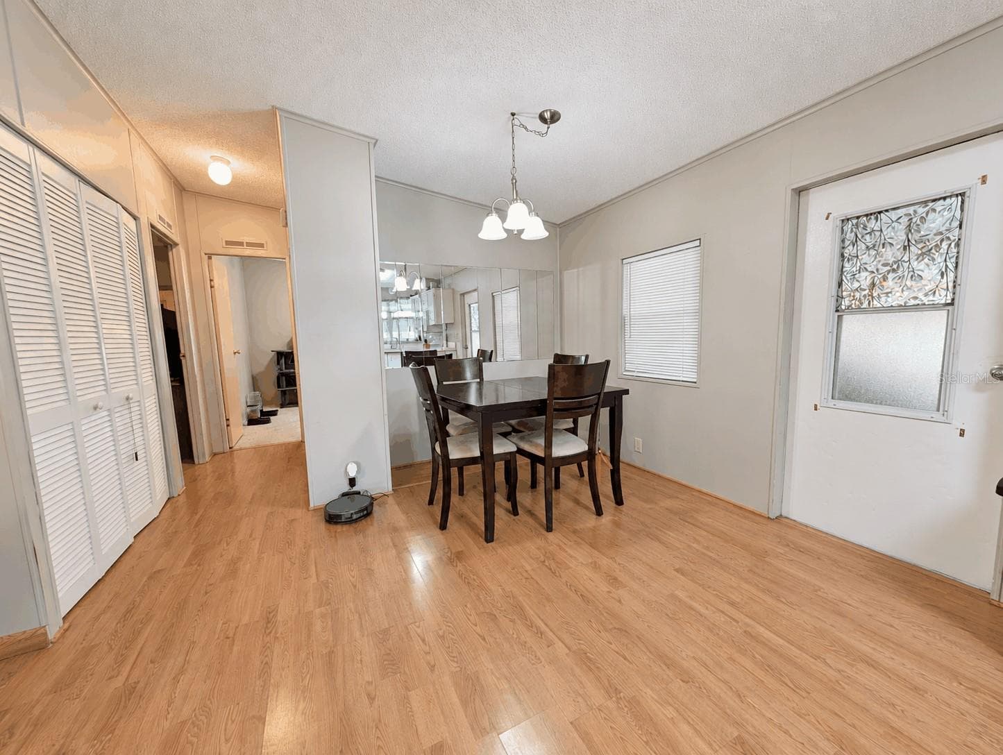 Dining Room and hallway view from Kitchen - 6066 SE SOUTHERN OAKS DR, WINTER HAVEN
