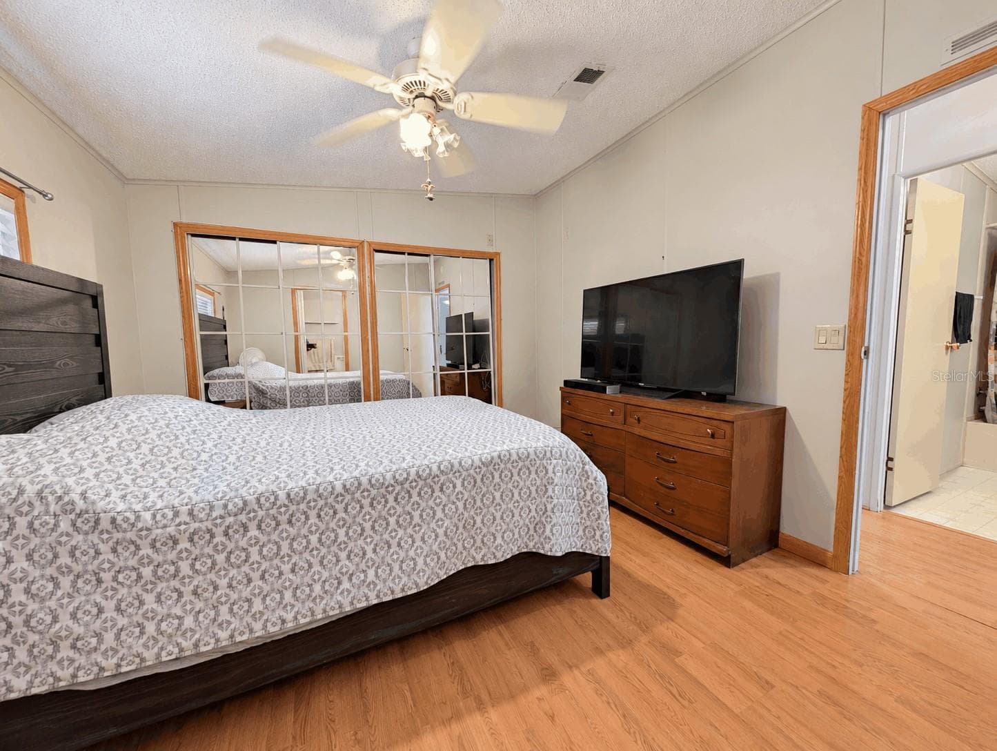 Primary bedroom view from En-Suite Bathroom - 6066 SE SOUTHERN OAKS DR, WINTER HAVEN