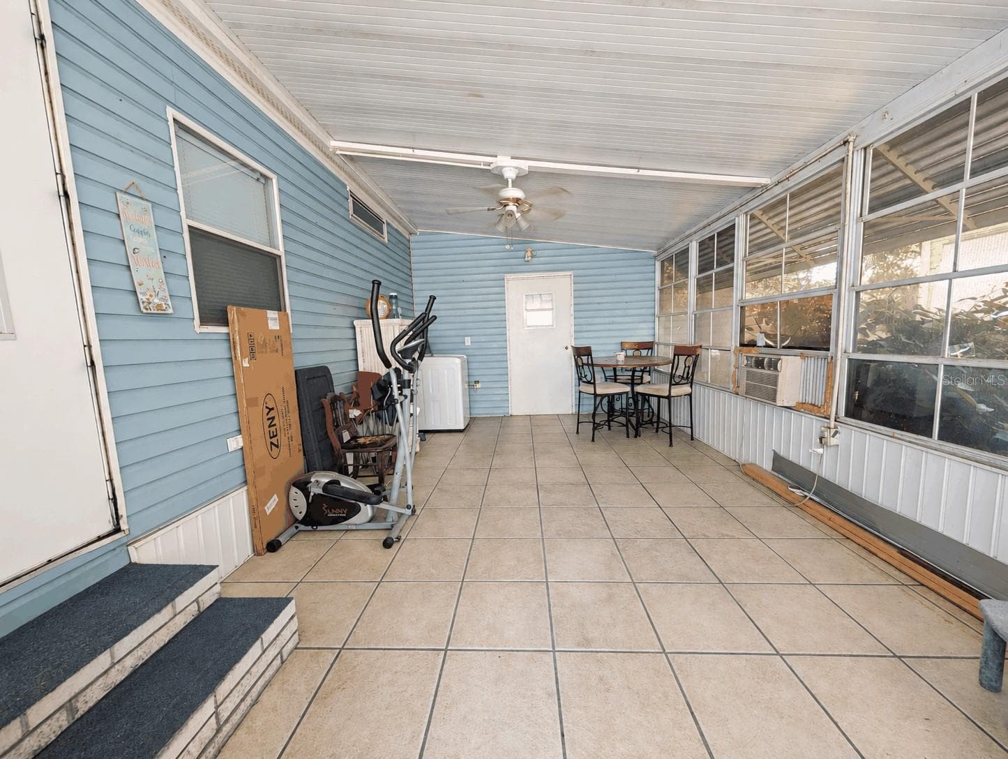 Side Screened Porch behind the Carport - 6066 SE SOUTHERN OAKS DR, WINTER HAVEN