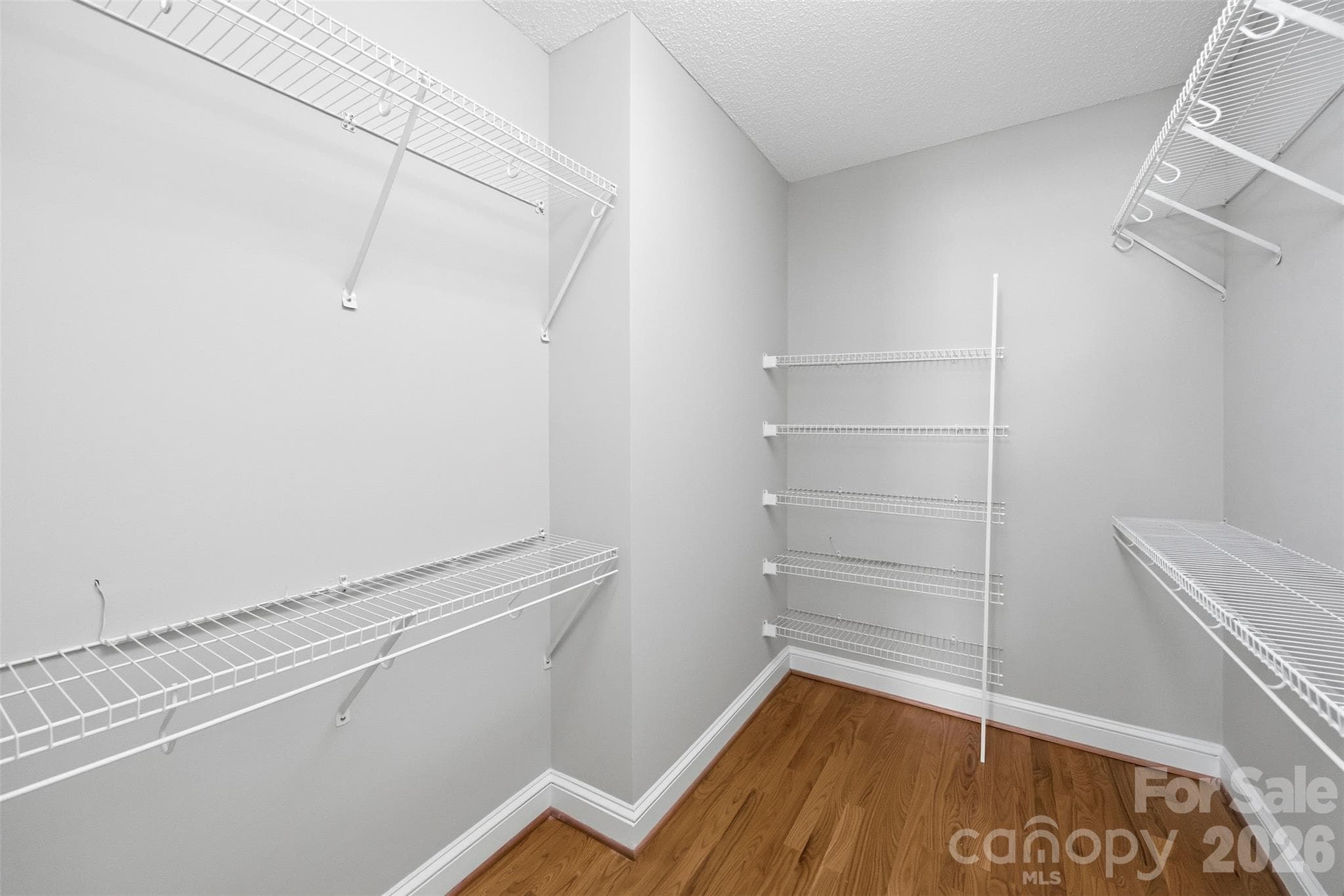 Walk-in closet in primary bedroom - 9014 Pickering Grove Lane, Charlotte