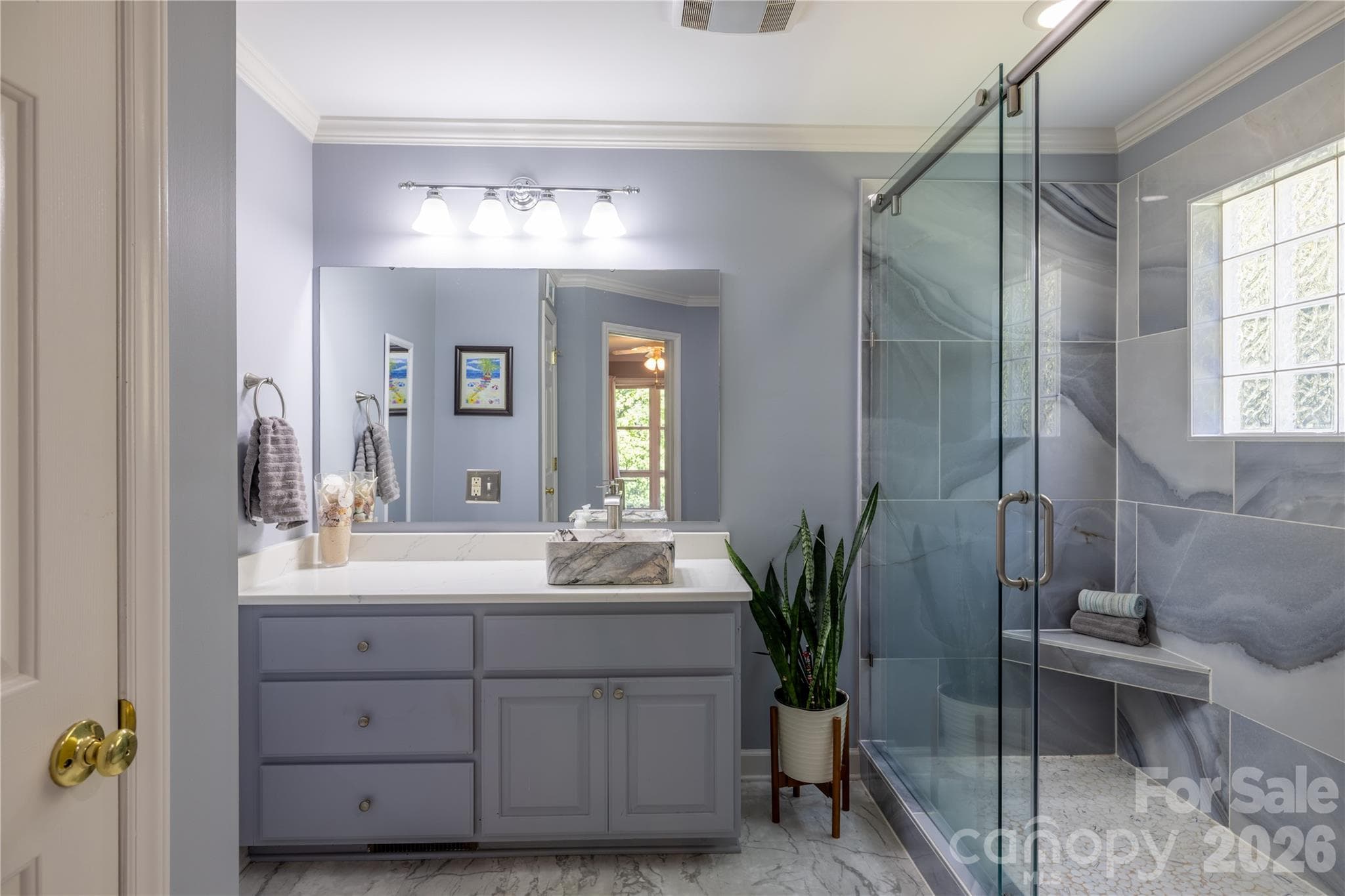 Completely remodeled primary bath with spacious ceramic tile shower.. - 571 Newport Drive, Mount Gilead