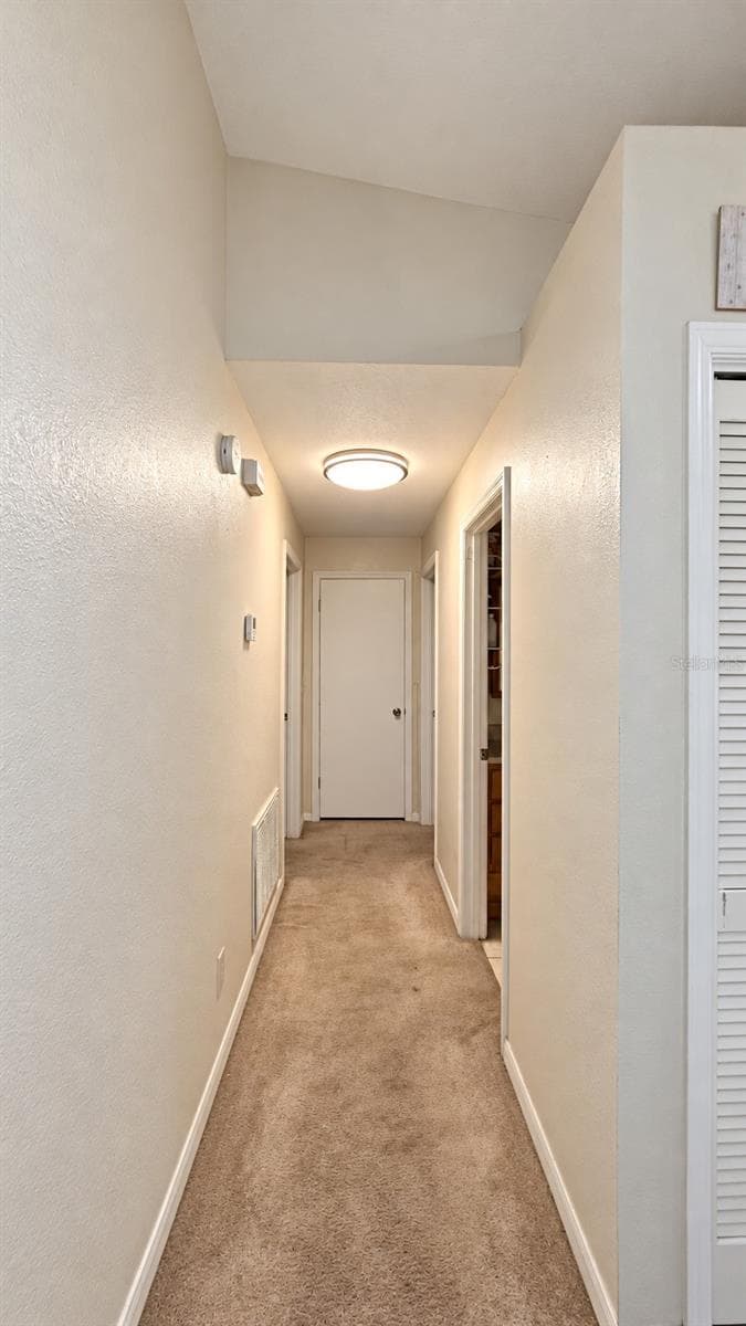 Hallway to Main Bedroom + Bedroom 2 + Bathroom 2 - 5636 BEECH ST, ZEPHYRHILLS