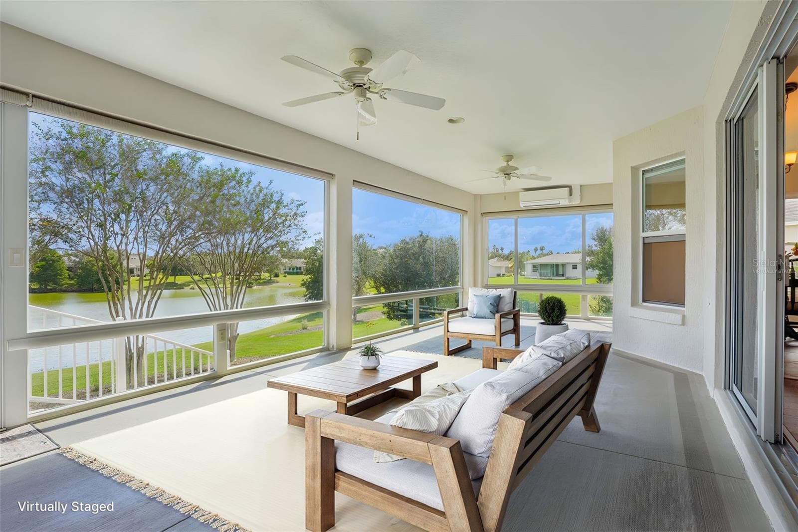 Virtually Staged Enclosed Lanai with Panoramic Elevated Water View - 494 ARBELLA LOOP, THE VILLAGES