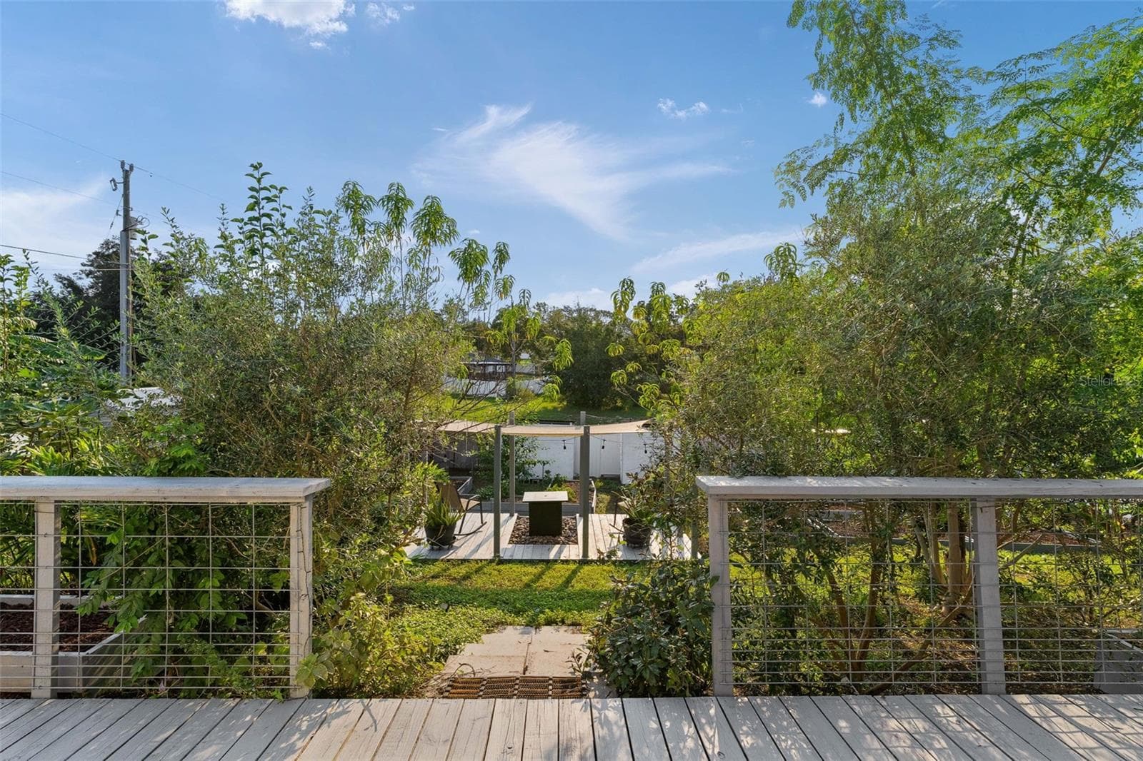 BACKYARD PLATFORM WITH FIRE PIT & SUNSHADE WITH LIGHTING - 15987 SW 55TH AVENUE RD, OCALA