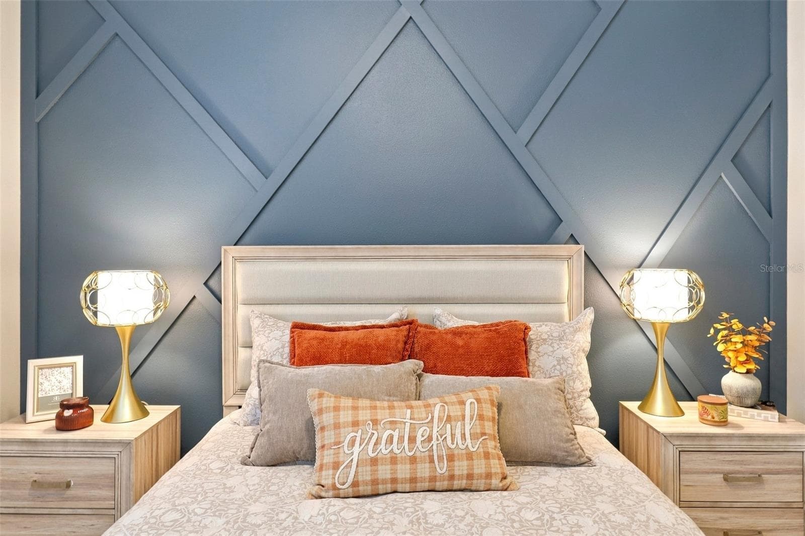 Bedroom Highlighting Geometric Accent  Wall - 33310 MAJOR OAK DR, WESLEY CHAPEL