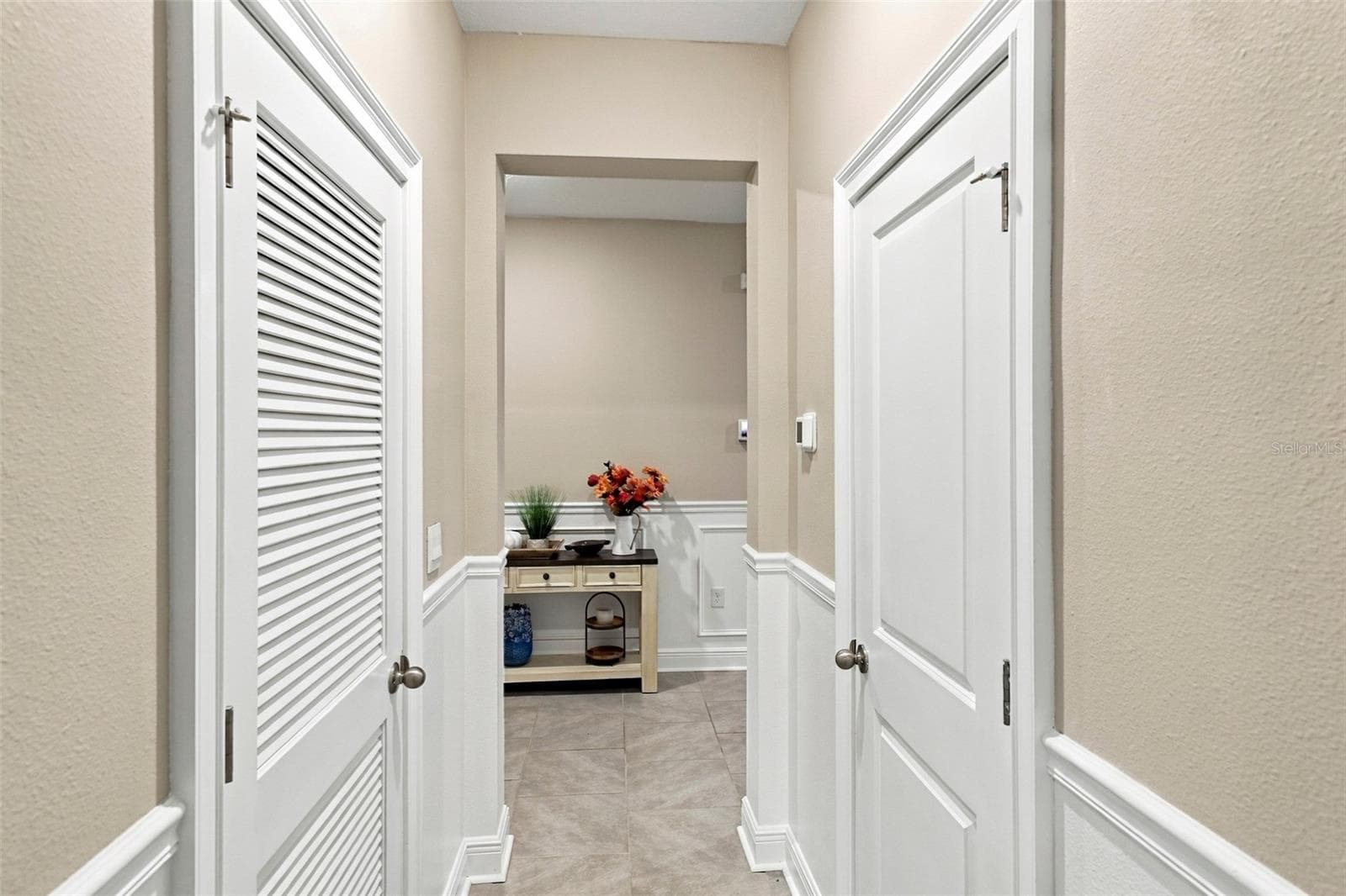 Beautiful Hallway Featuring Decorative Wall Molding and Tile Floor - 33310 MAJOR OAK DR, WESLEY CHAPEL