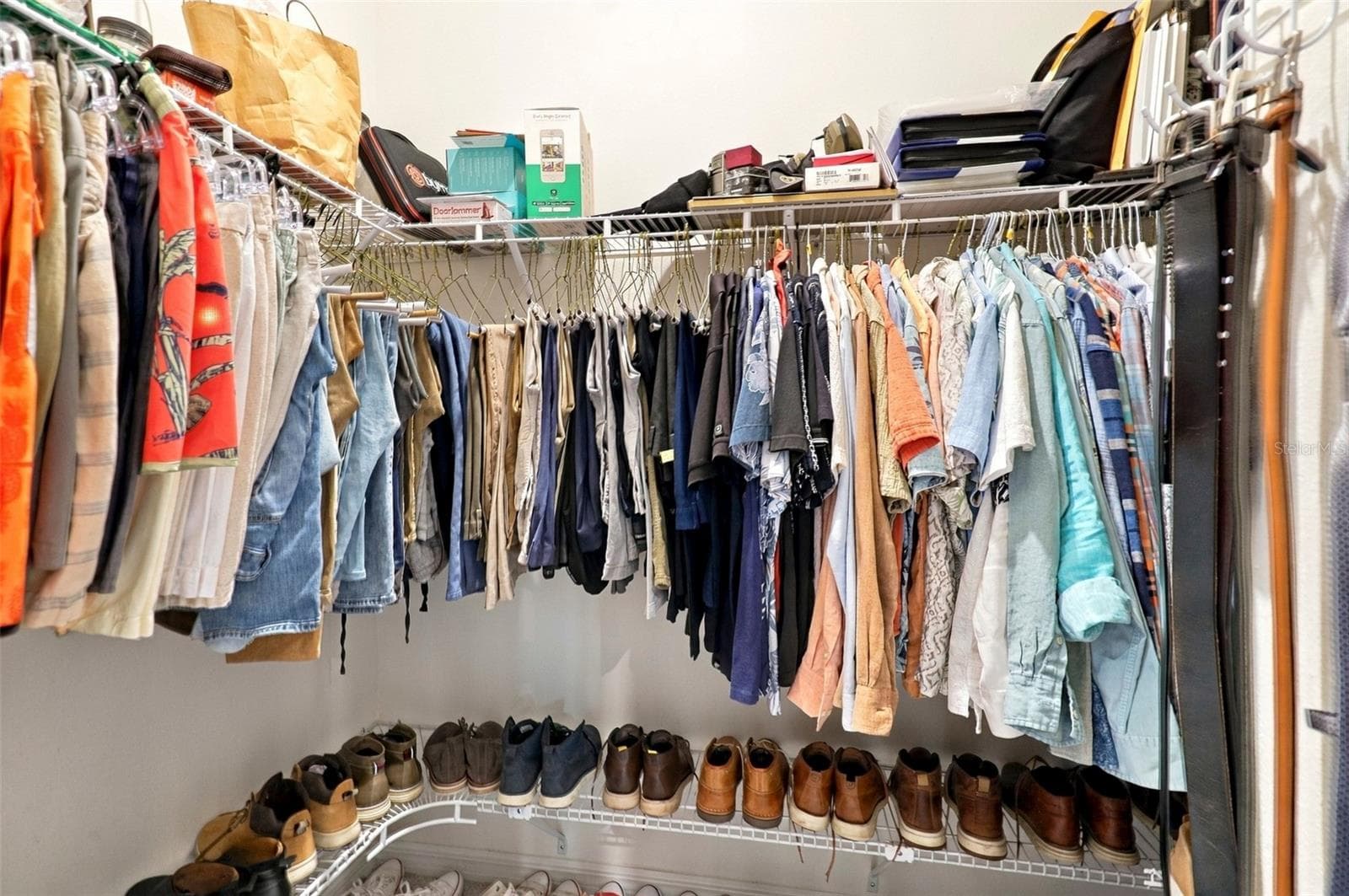 Spacious Walk-In Closet For Him with Built-In Shelving - 33310 MAJOR OAK DR, WESLEY CHAPEL