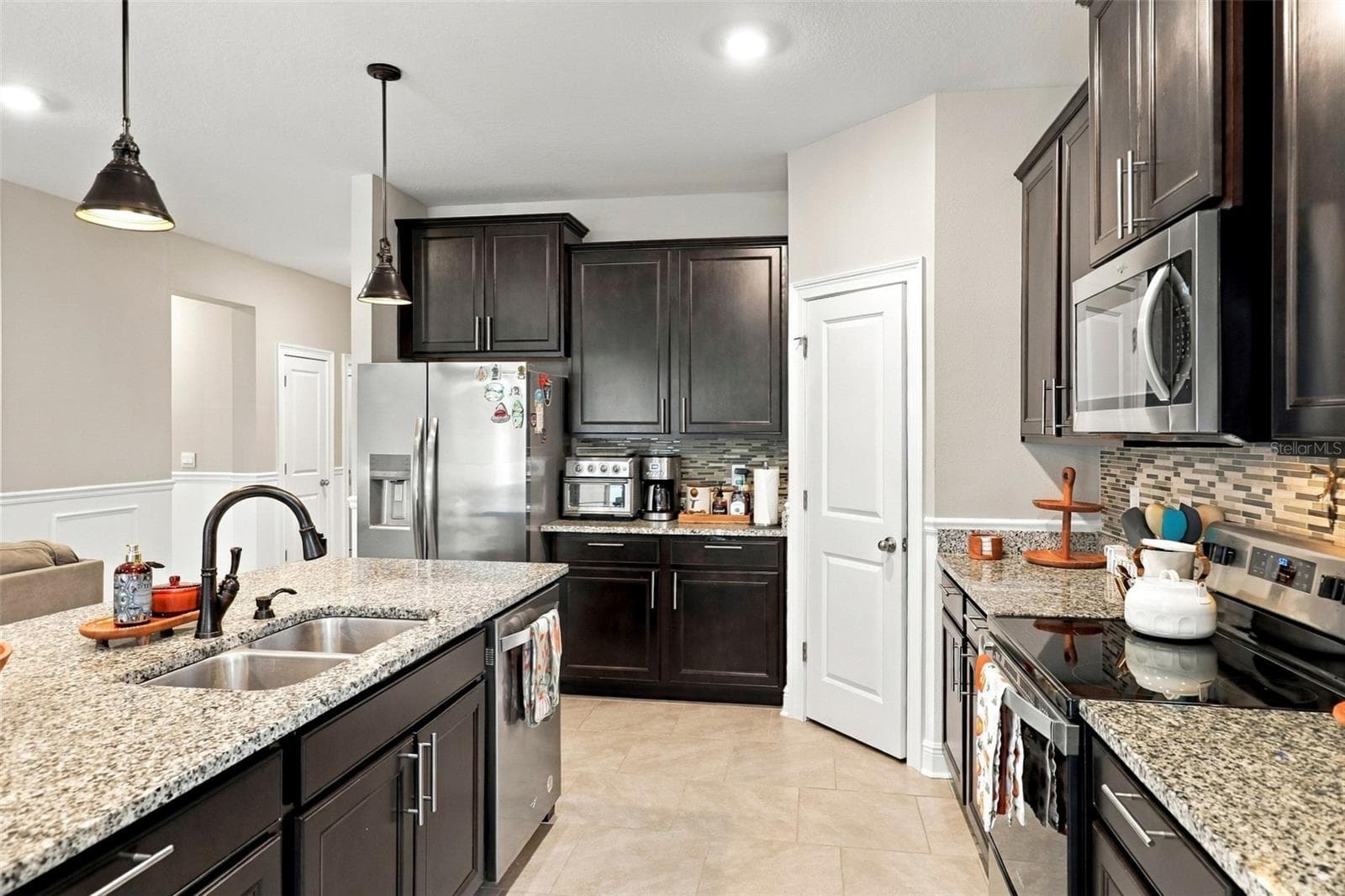 Spacious Kitchen with Ample Cabinetry and Counter Space - 33310 MAJOR OAK DR, WESLEY CHAPEL