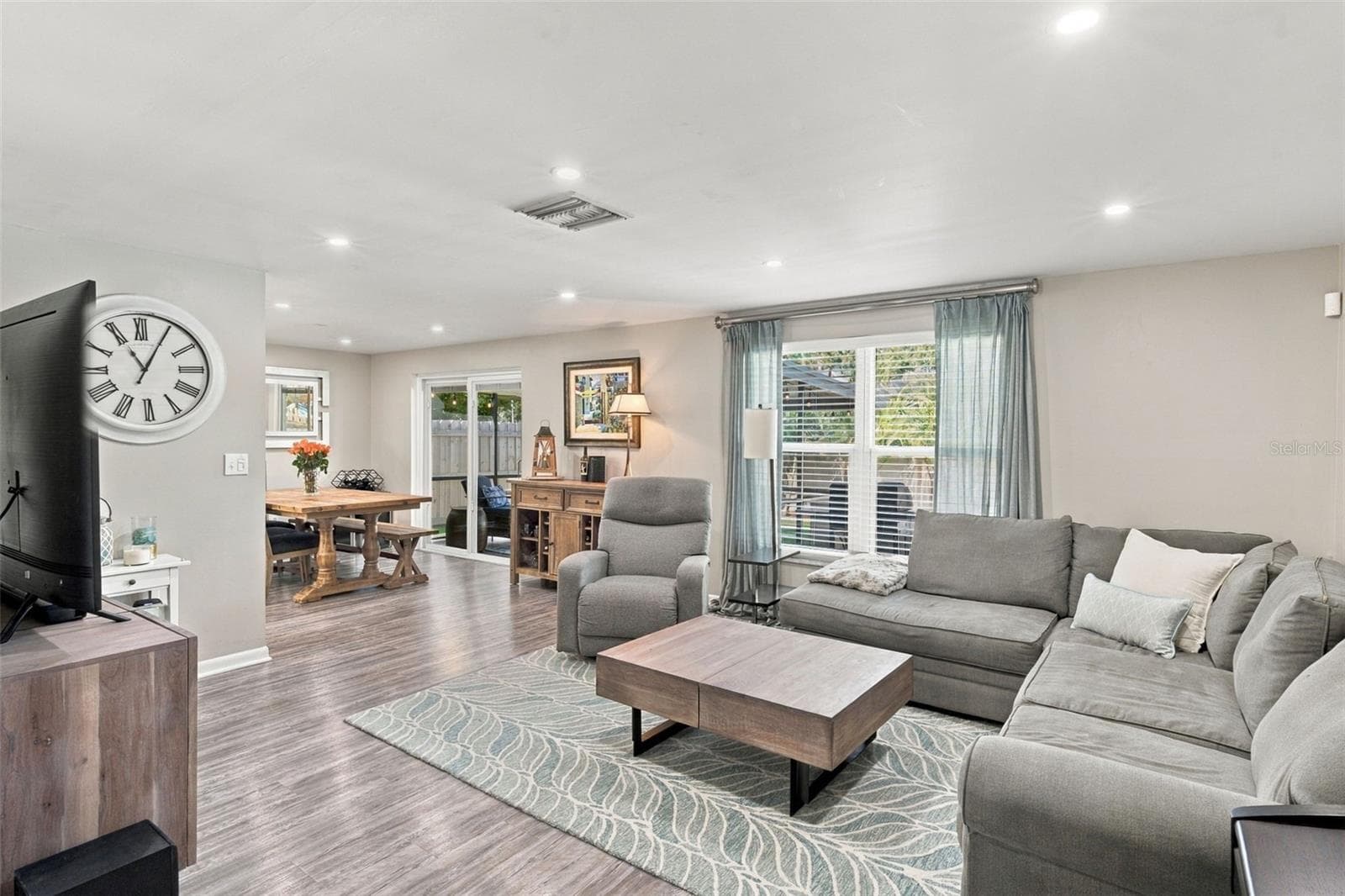 Living room - 2022 Lux. vinyl flooring, new lighting - 16136 FOXFIRE DR, TAMPA