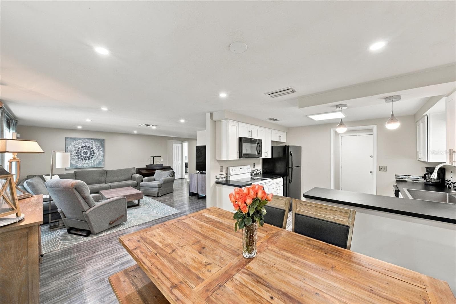 OPEN FLOOR PLAN - Dining room, kitchen and living room - 16136 FOXFIRE DR, TAMPA