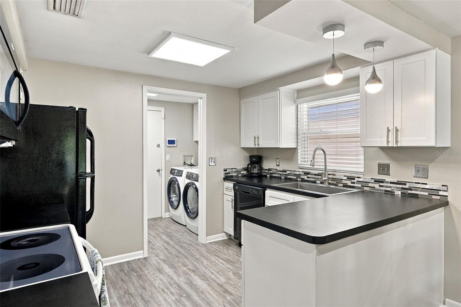 Kitchen features shaker-style cabinets with soft-close hardware - 16136 FOXFIRE DR, TAMPA