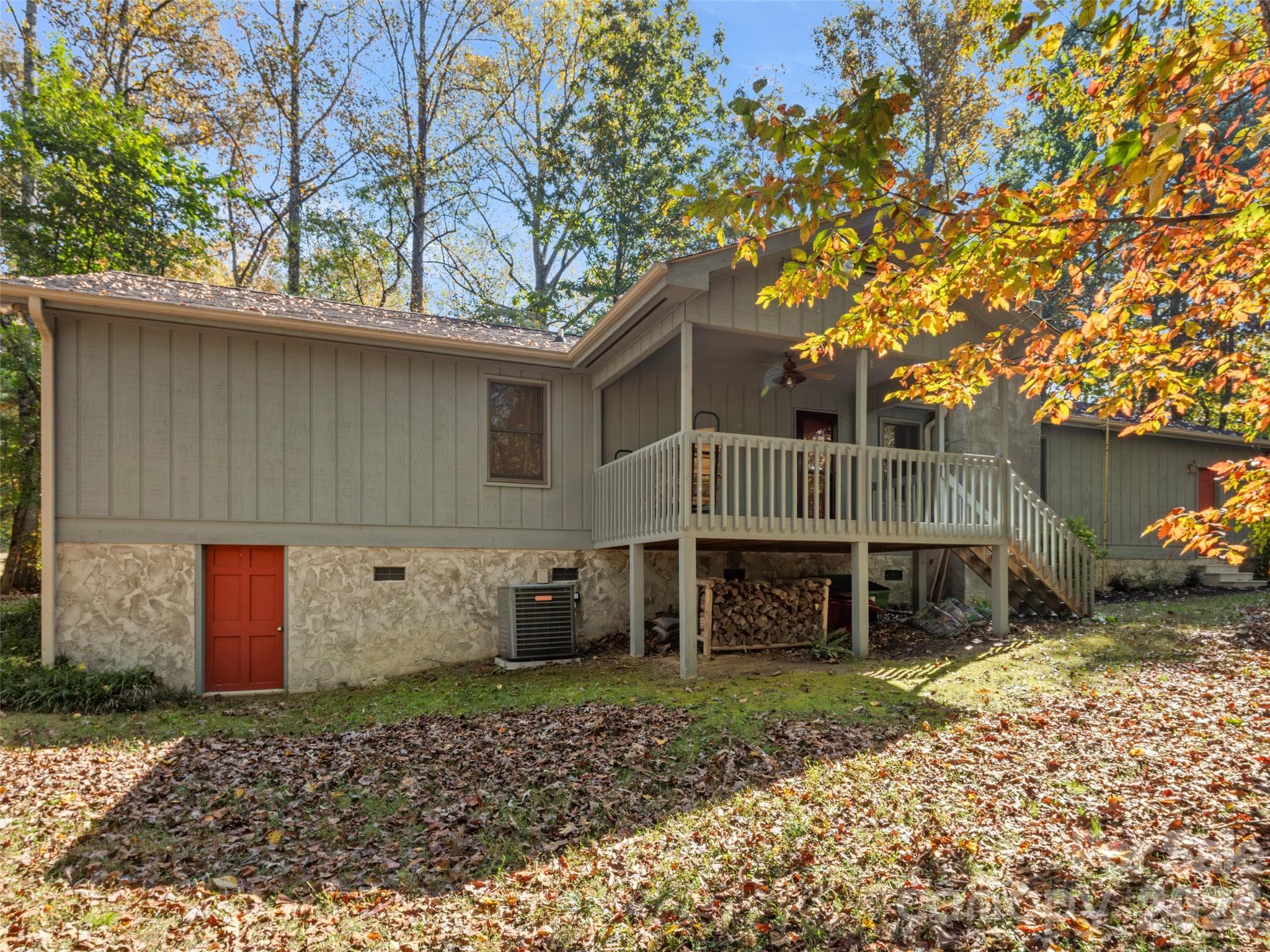 Rear of home with access to underneath of home with storage space - 45 Bearwallow Road, Hendersonville