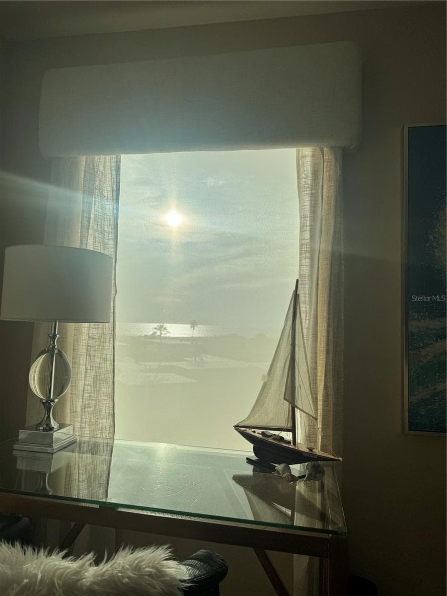 Electric Blinds block the Glare NOT the View, photo taken on October 16 at 5:51 PM. - 11605 GULF BLVD #503, TREASURE ISLAND