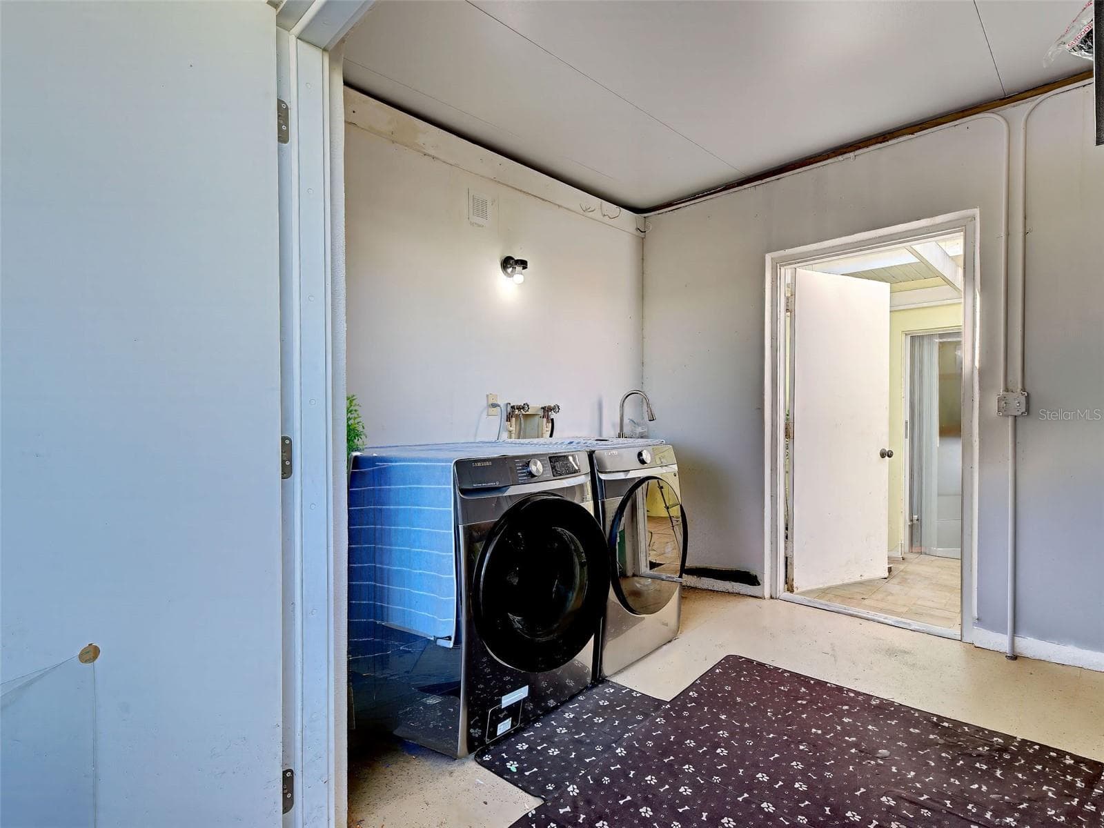 Laundry room is off of the front patio. Lots of room for storage. - 324 WEXFORD TER #171, VENICE