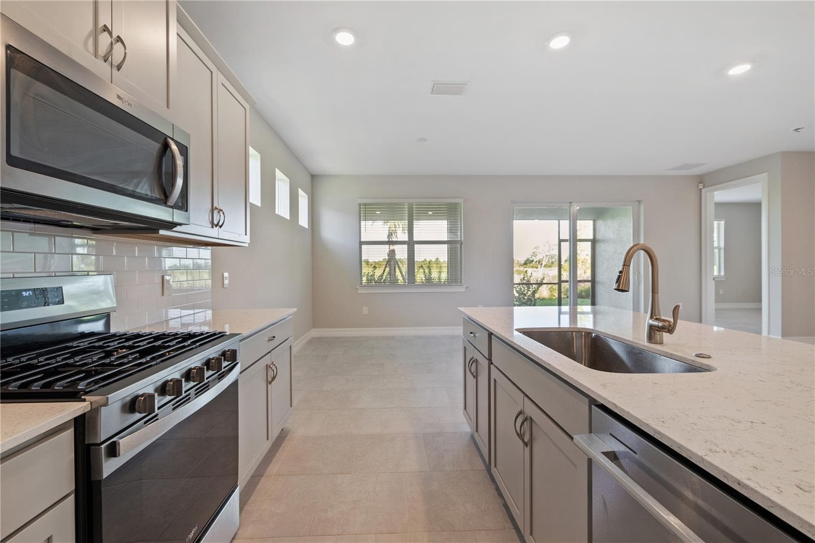 Kitchen Island with dishwasher and sink. - 17740 SHADE TREE LOOP, PUNTA GORDA