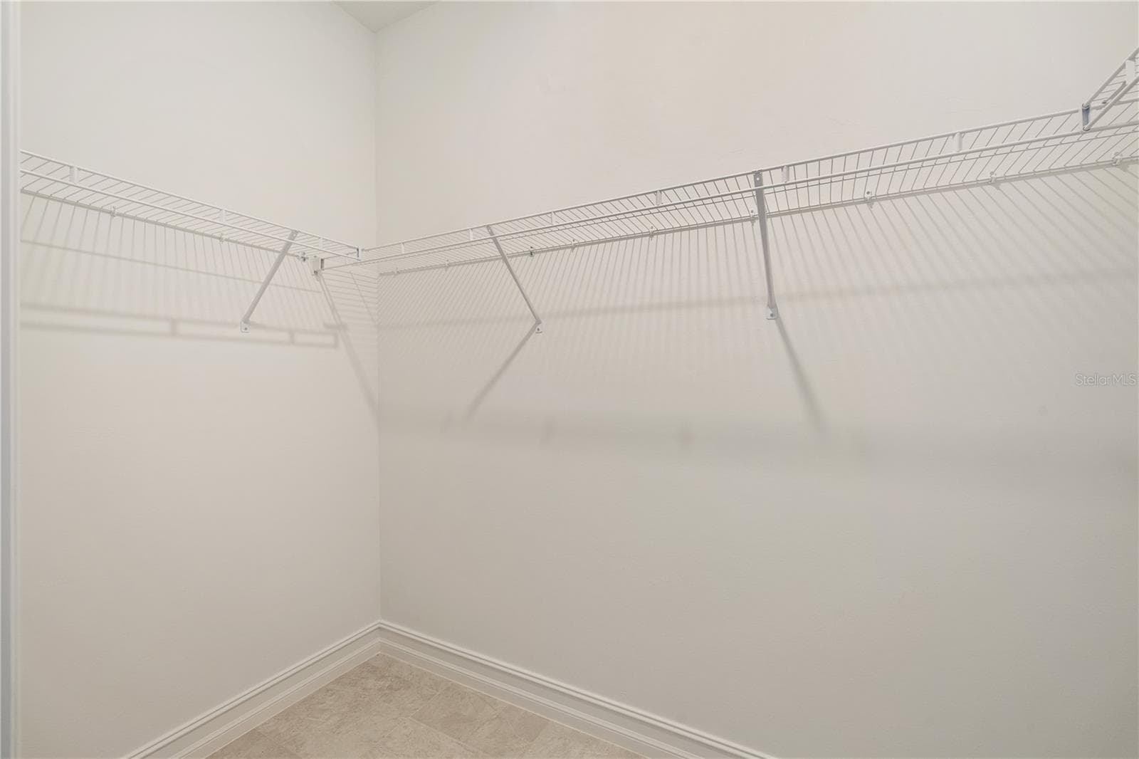 Two walk-in closets in Primary Bedroom - 17740 SHADE TREE LOOP, PUNTA GORDA
