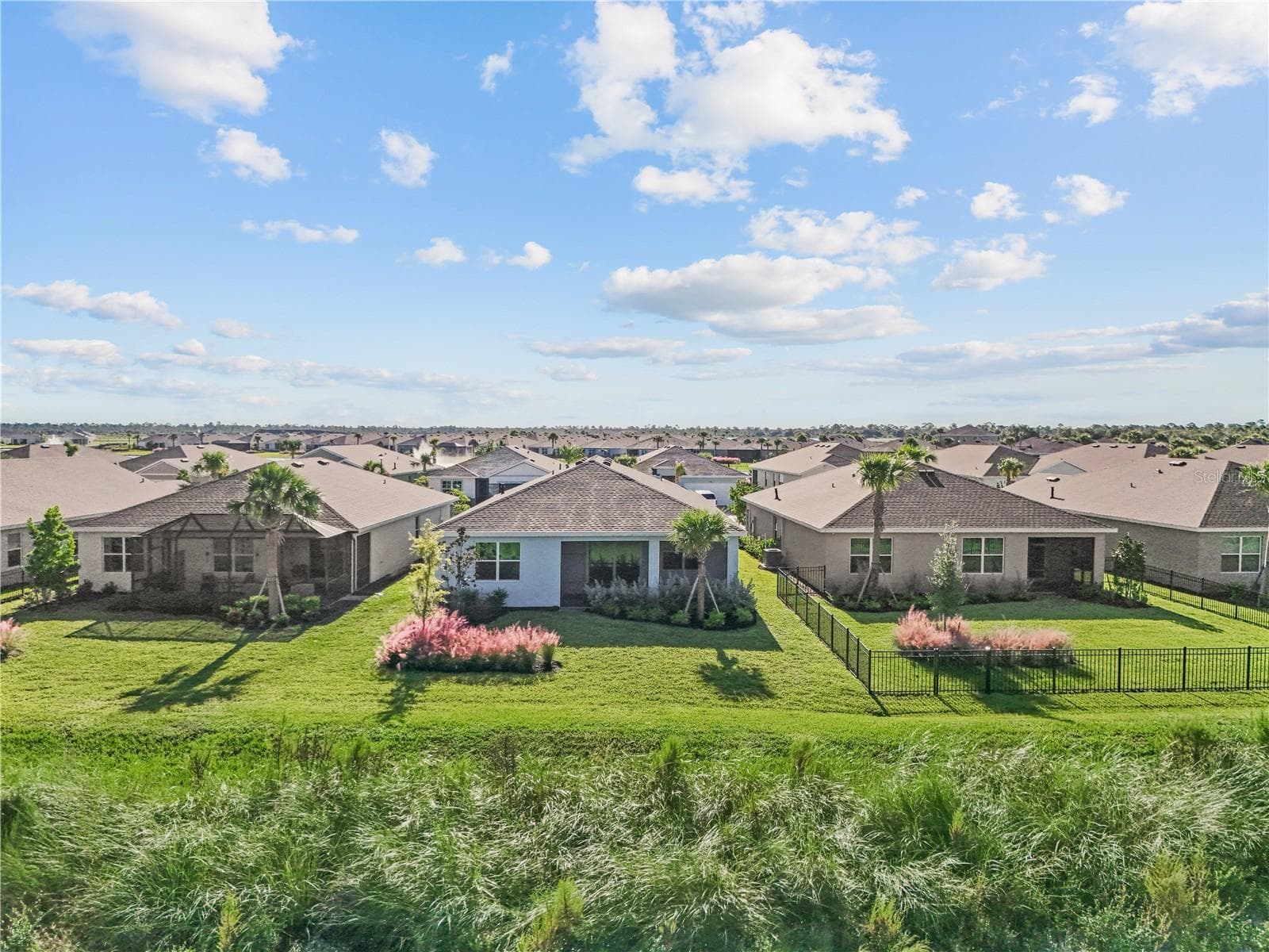Drone view of back of home. - 17740 SHADE TREE LOOP, PUNTA GORDA
