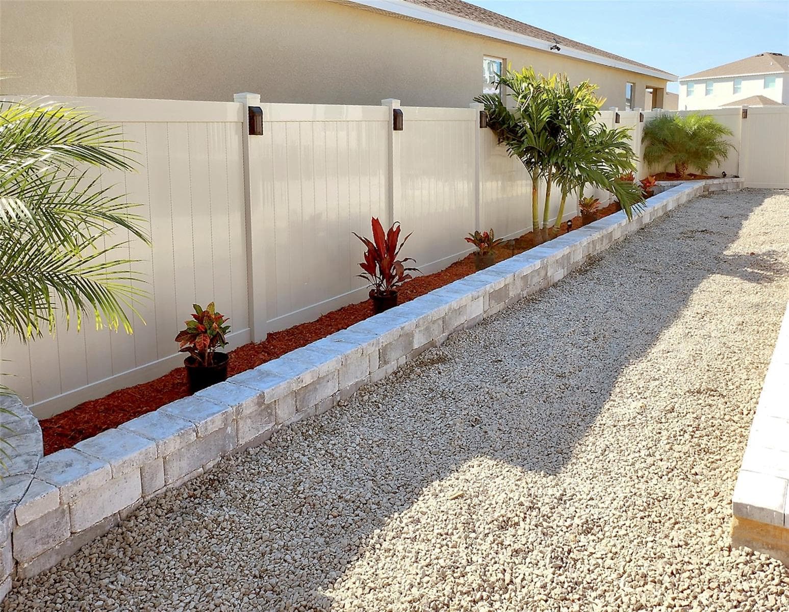 Backyard low-maintenance landscaped with decorative stone - 33310 MAJOR OAK DR, WESLEY CHAPEL