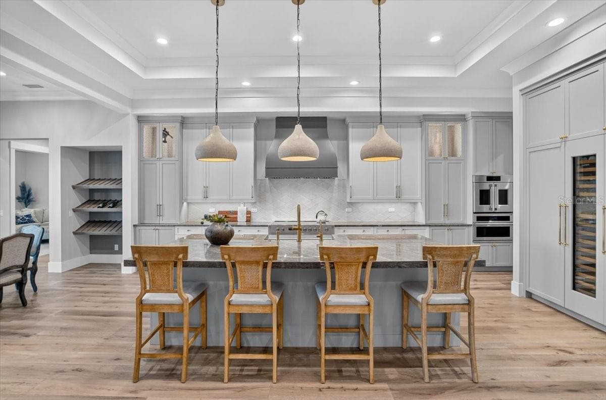Dovetail Wood Cabinetry with Display Shelving.  Designer pendants. - 1625 RIO VISTA TER, PARRISH