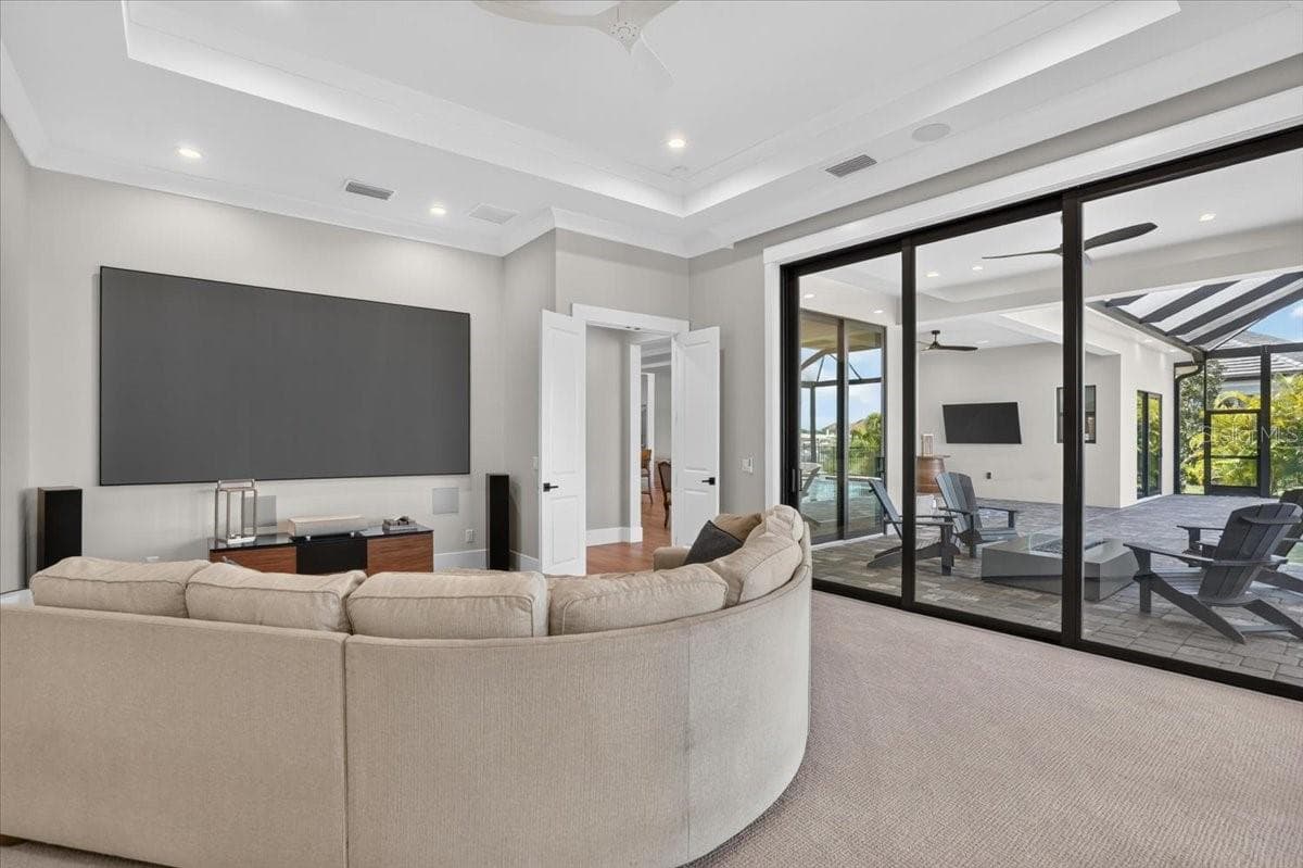 140" screen, short throw projector, two in-wall subs, immersive theater quality audio - 1625 RIO VISTA TER, PARRISH