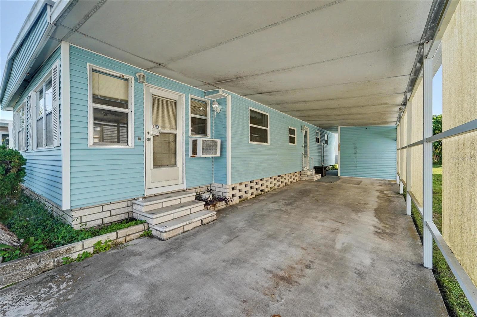 Large Carport and storage shed straight ahead - 1500 COUNTY ROAD 1 #219, DUNEDIN