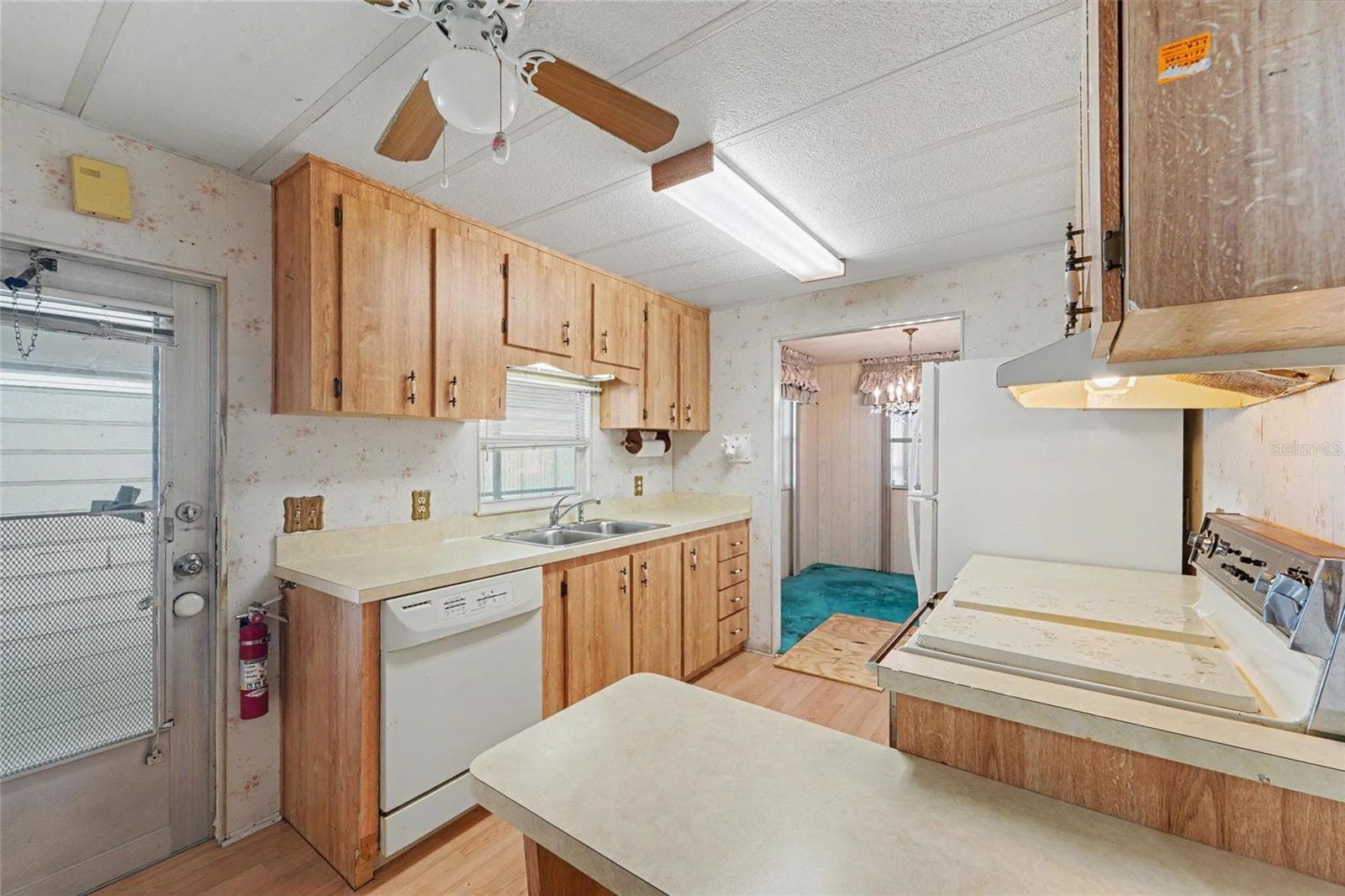 Cabinets are in decent shape, new hardware would make big difference - 1500 COUNTY ROAD 1 #219, DUNEDIN