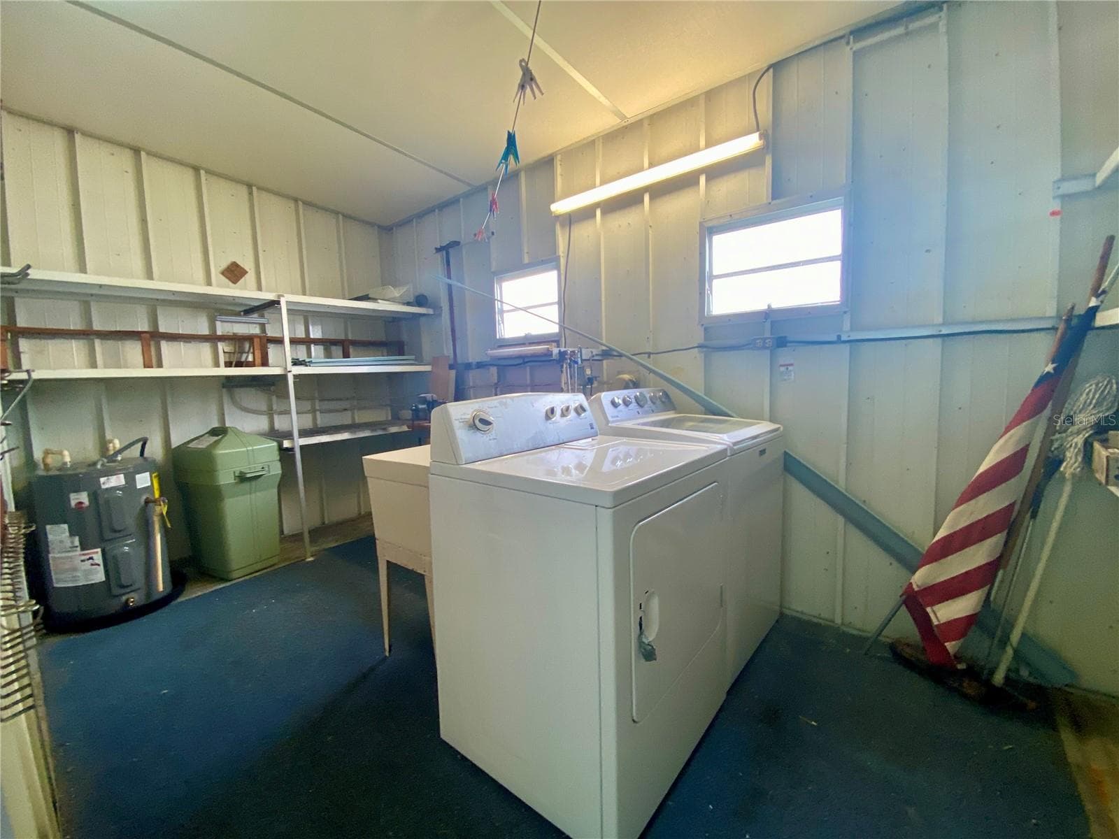 Utility Shed:washer, dryer, 2021 Hot water heater, slop sink - 1500 COUNTY ROAD 1 #219, DUNEDIN