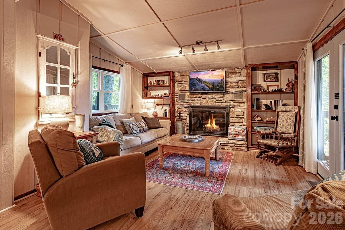 Sit by the fire in this cozy living room - 208 N West Lake Drive, Lake Lure