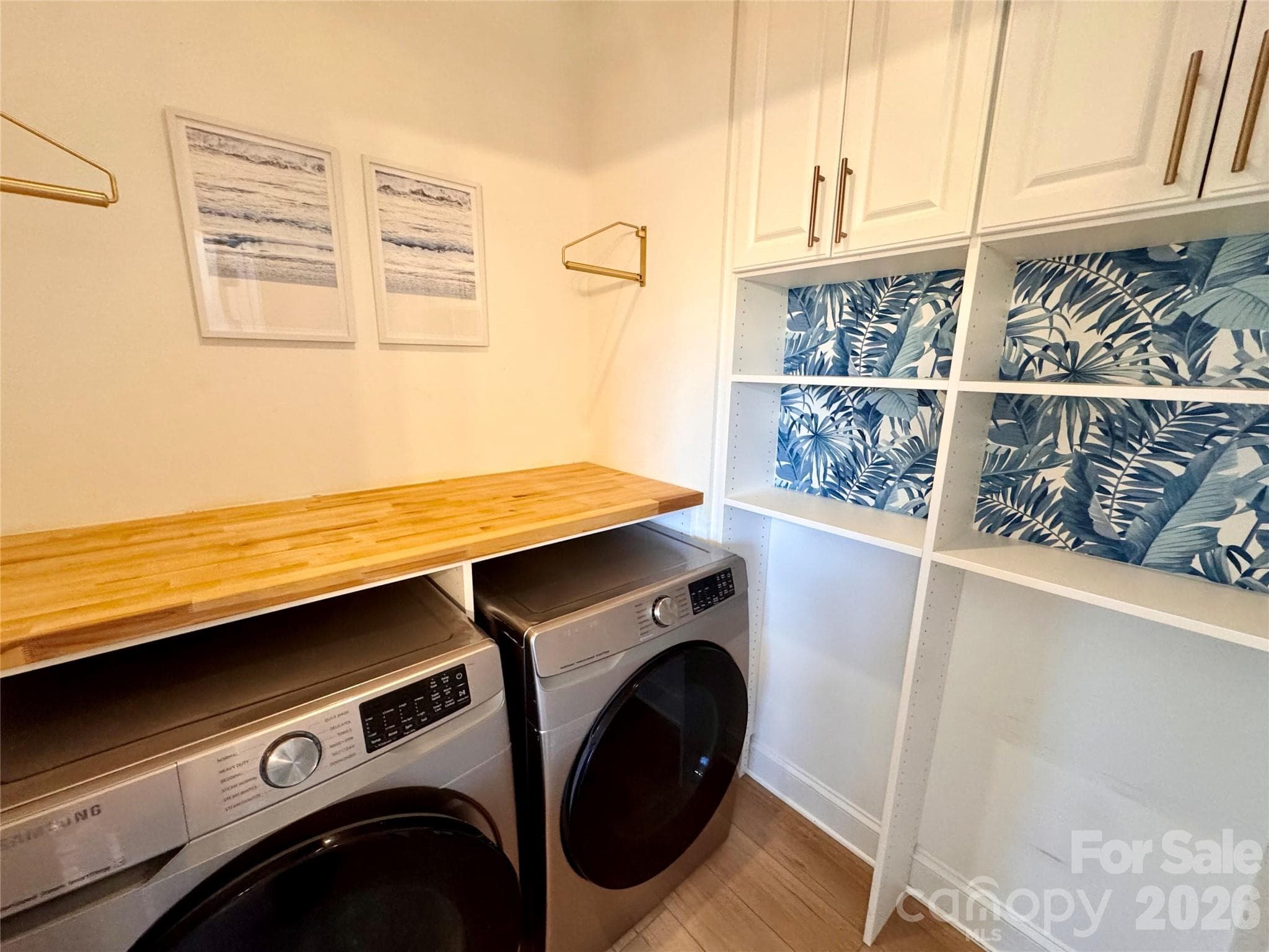 Laundry room with the cutest design details. Washer/dryer convey. - 7101 Founders Way, Harris