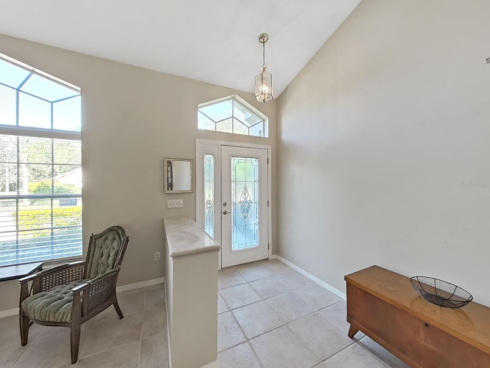 leaded glass front door with side light and fan light, cathedral ceilings - 15001 MEADOWLAKE ST, ODESSA