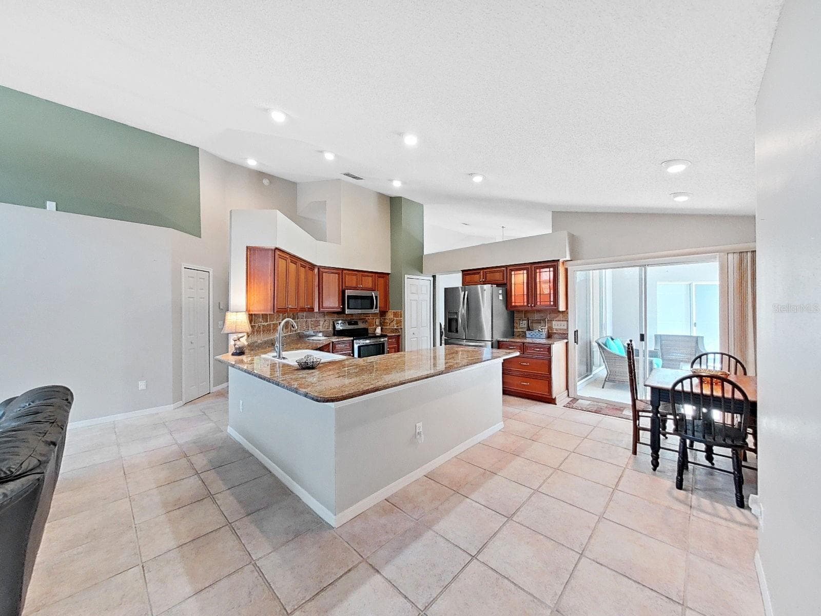 updated kitchen with granite countertops, stainless appliances, recessed lighting - 15001 MEADOWLAKE ST, ODESSA