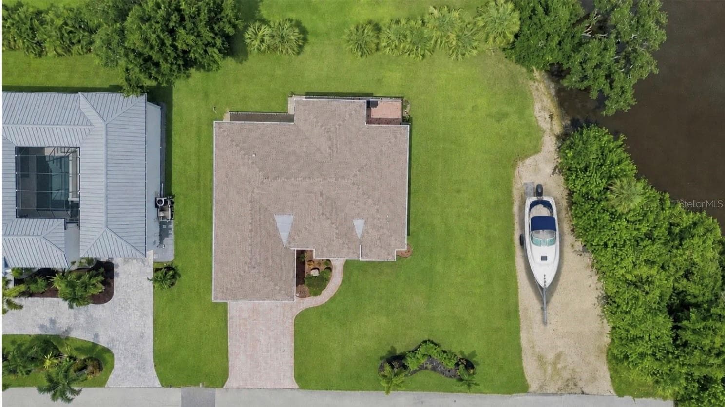 Virtual staged boat in drive - 200 MONTANA AVE, NOKOMIS