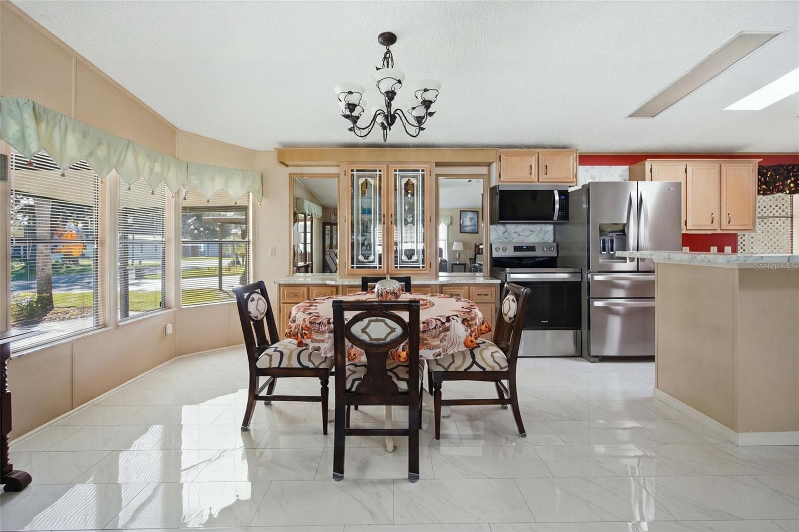 Virtually enhanced image depicting the anticipated finished appearance of the kitchen island. Island finishing work is pending completion. - 113 JACKSON PARK AVE, DAVENPORT