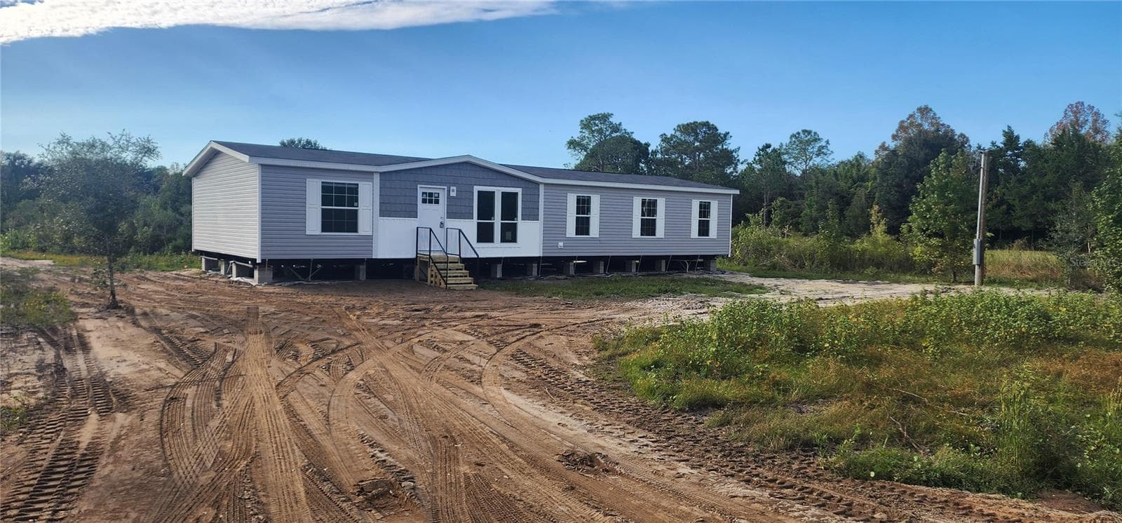 Manufactured Home at 1636 MISTLETOE ST, BUNNELL, photo 2 of 51