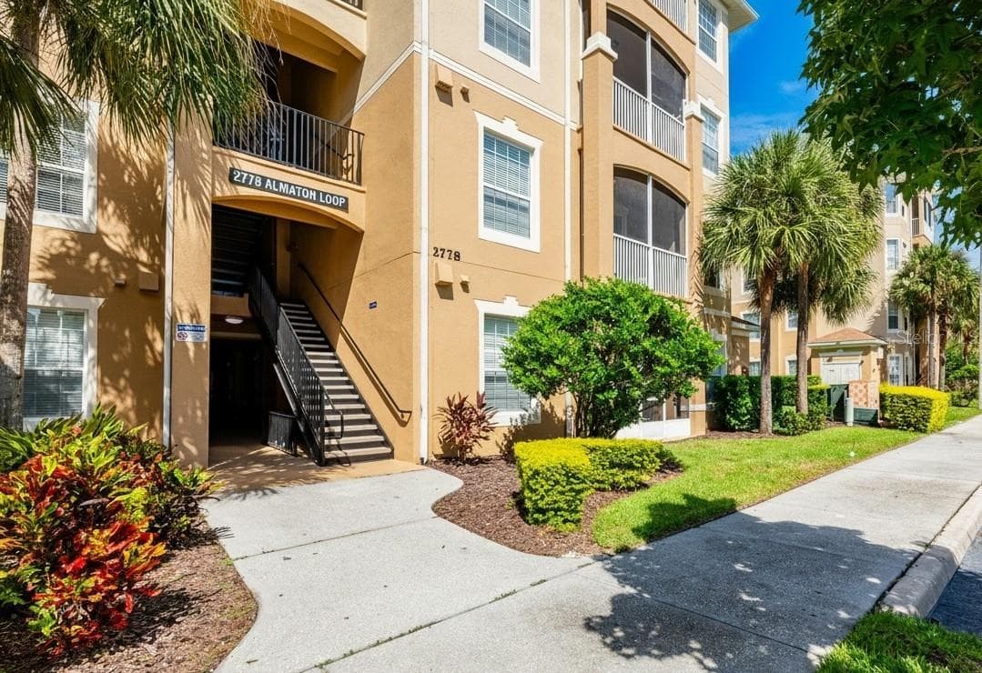 Welcome **HOME** to your covered entry. Building includes elevator for convenient accessibility for all! - 2778 ALMATON LOOP #204, KISSIMMEE