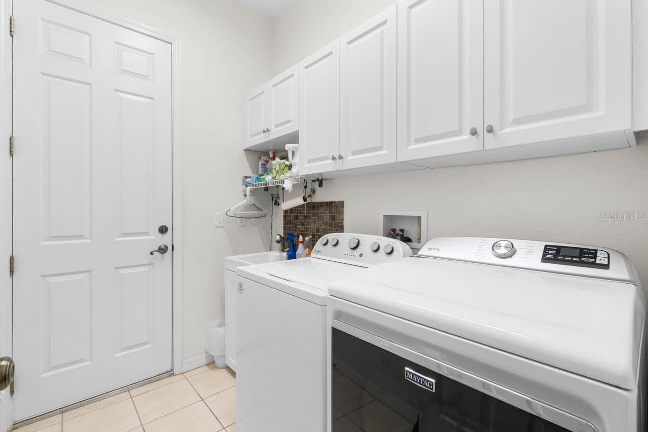 Laundry room leading to the dual garage. - 1009 CHELSEA GREENS CT #37, SUN CITY CENTER