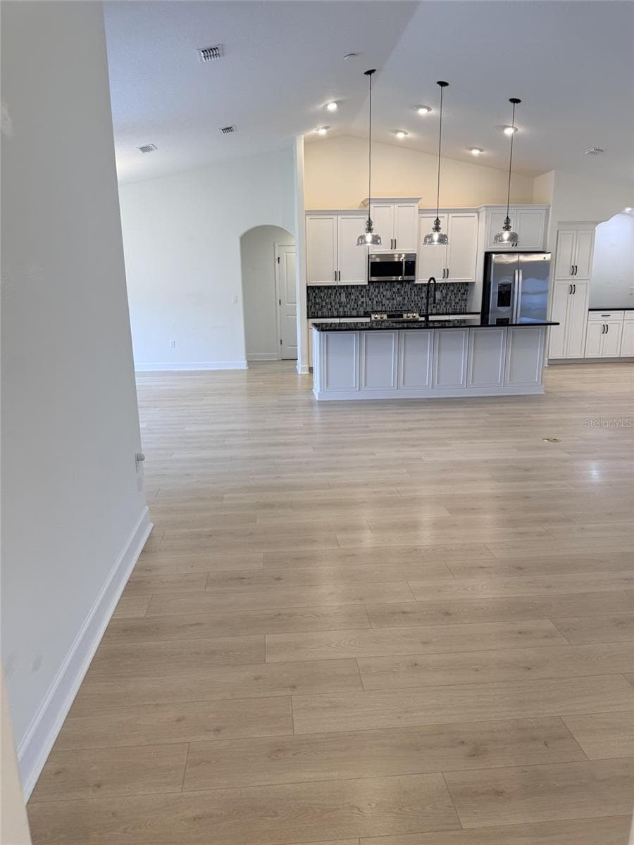 Family room looking at kitchen - 21 WOOD CLIFT LN, PALM COAST