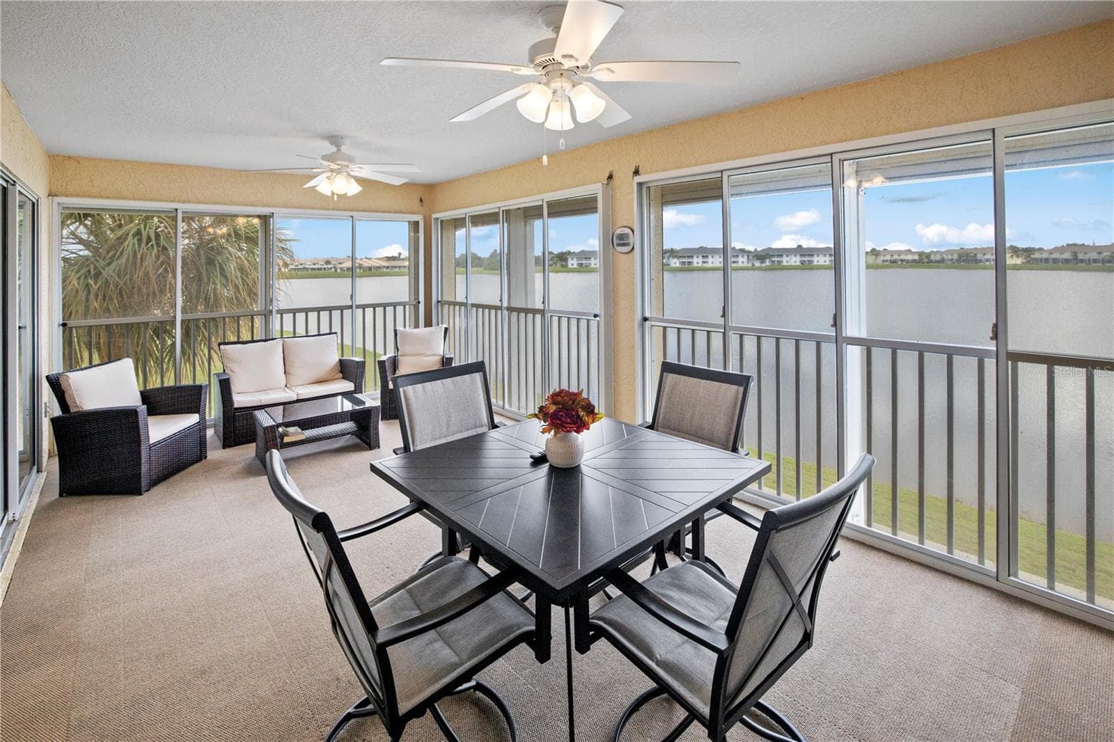 Impressive 20ft, 4 Season, Screened Lanai with Roll Down Shutters Serene View of Lake Rio - 26283 NADIR RD #201, PUNTA GORDA