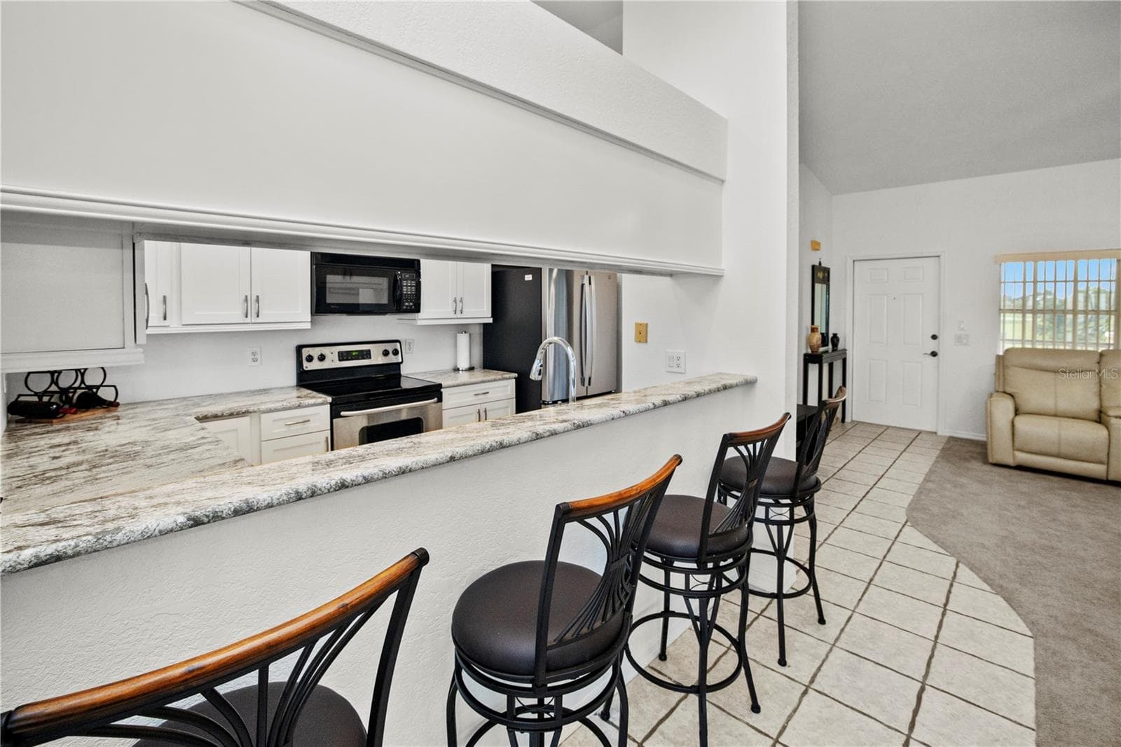 Extra Seating at the Breakfast Bar for Entertaining - 26283 NADIR RD #201, PUNTA GORDA